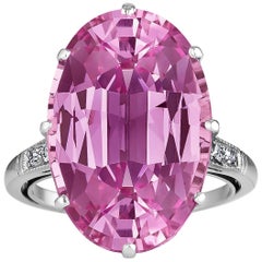 Anello in platino con diamante e topazio rosa taglio ovale