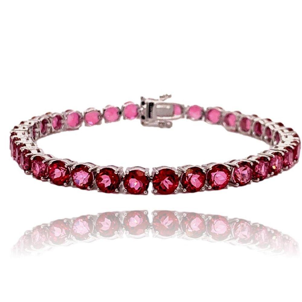 This stunning 10K White Gold Pink Topaz Tennis Bracelet has 35 5mm round vibrant Pink Topaz all with 4 prong setting. The bracelet is 7