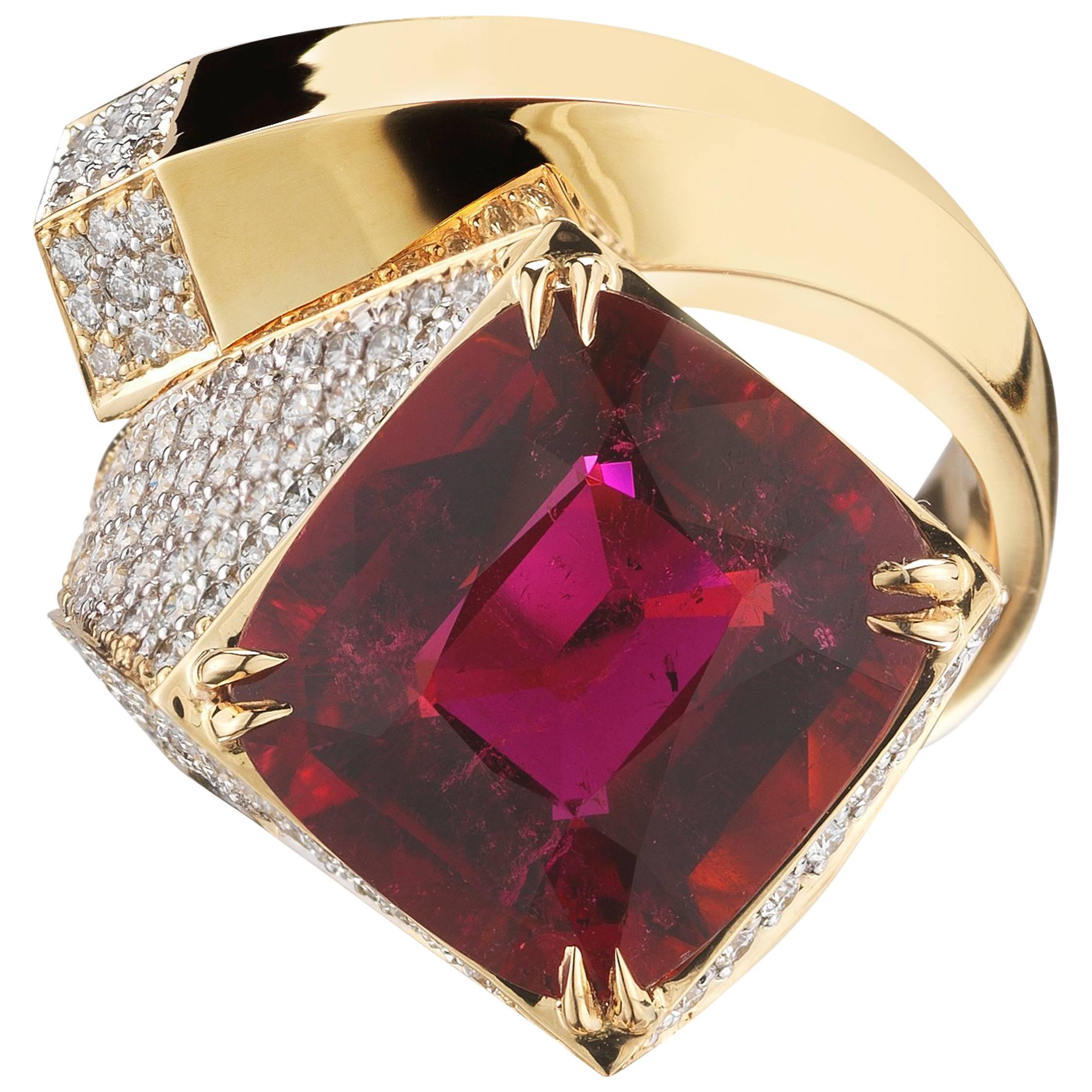 From the award-winning Brillante collection, a one of a kind cushion shape pink tourmaline 'Contrarie' ring, 8.84 carats, set in high polish 18kt yellow gold with pave-set round brilliant diamonds, 1.57 carats.

Translated from a quintessential