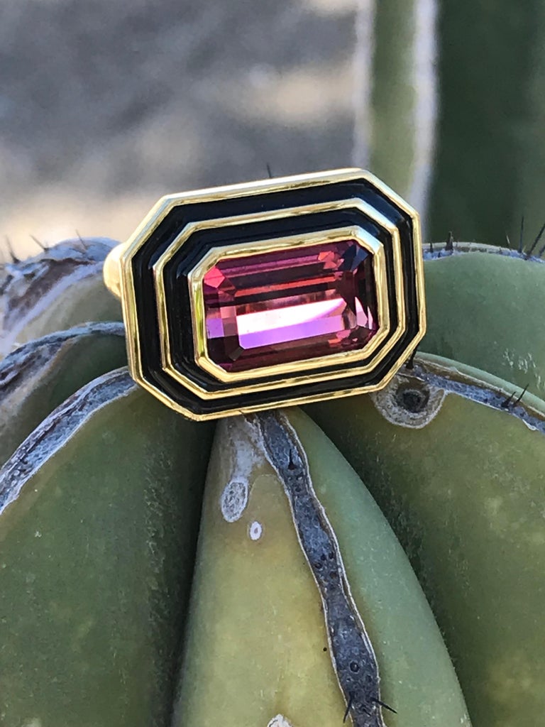 A very chic 6.55 pink tourmaline ring in an Emerald step cut. It is set in an 