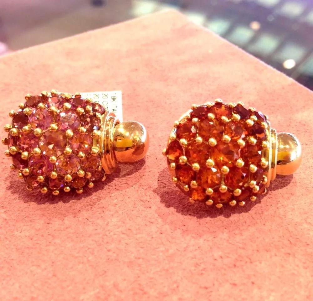 Italian made Round Citrine and Pink Tourmaline Cluster Earrings in 18k Yellow Gold

Beautiful Pink and Orange Cluster Earrings feature 20 Round Cut Pink Tourmaline Stones on one earring and 20 Round Cut Citrine Stones on other earring, all bead set