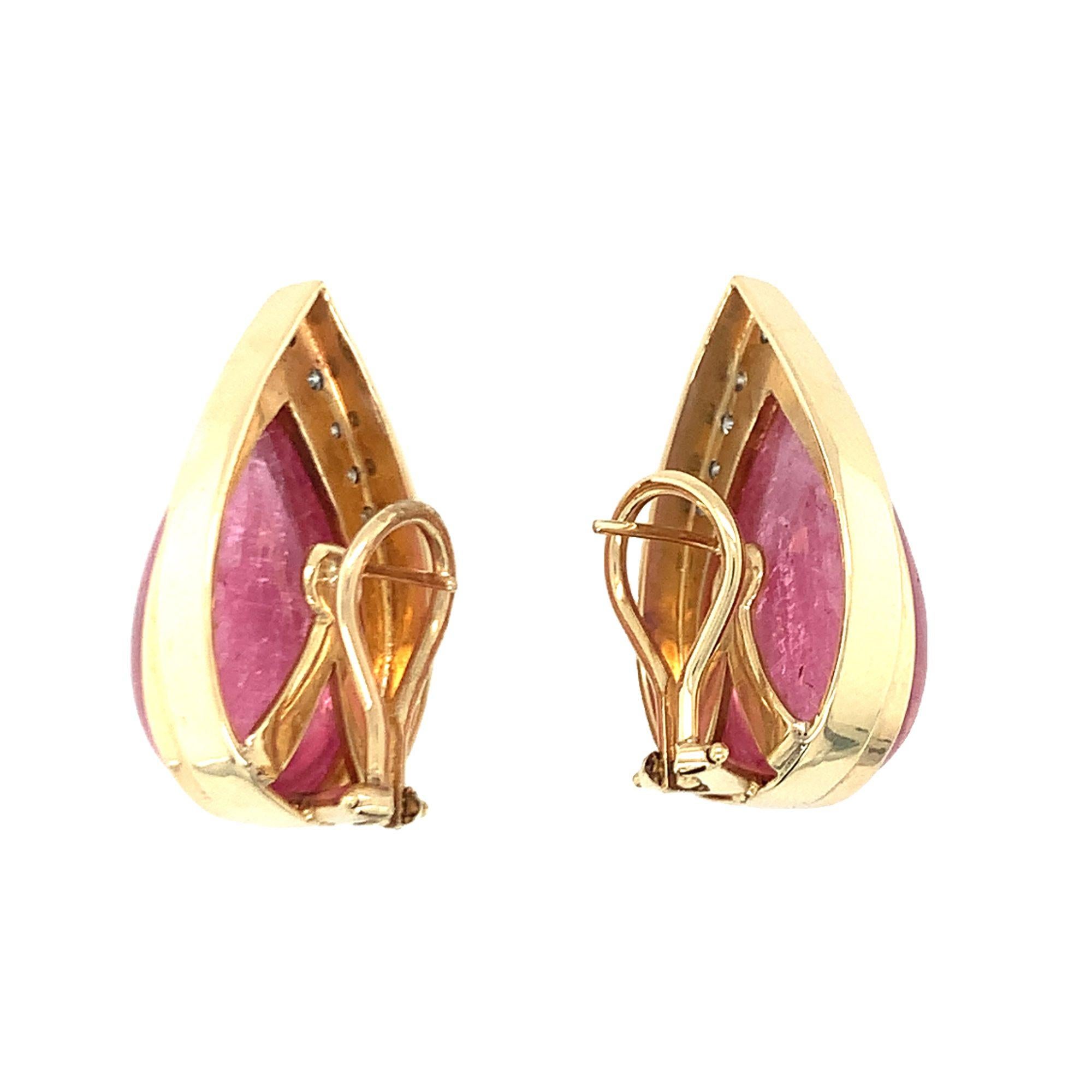 One pair of pink tourmaline and diamond earrings featuring two pear-shaped cabochon tourmalines totaling 40 ct. accented by 18 round brilliant cut diamonds totaling 0.55 ct. With Omega backs and posts. Circa 1970s.

Vibrant, designer,