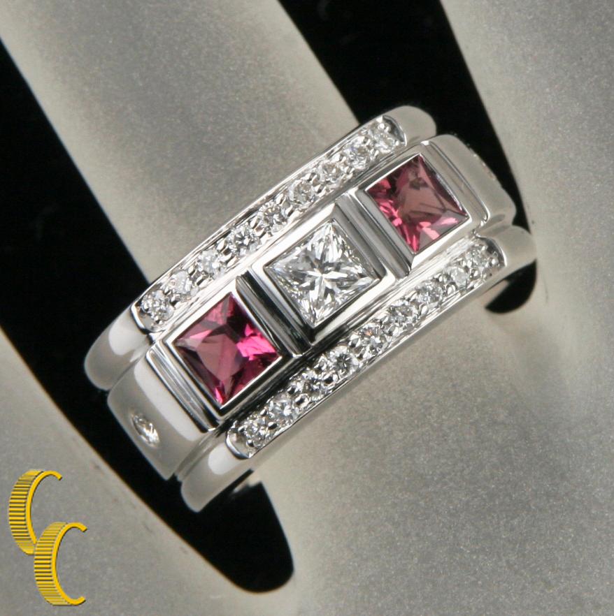 Gorgeous, Heavy 18k White Gold Band Ring
Features Three Adjacent Princess Cut Stones (Diamond Accented by Pink Tourmaline) with a Row of Pave-Set Round Brilliant Diamonds on the Top and Bottom
Reverse of the Top of the Ring Has Nice Heart Motif