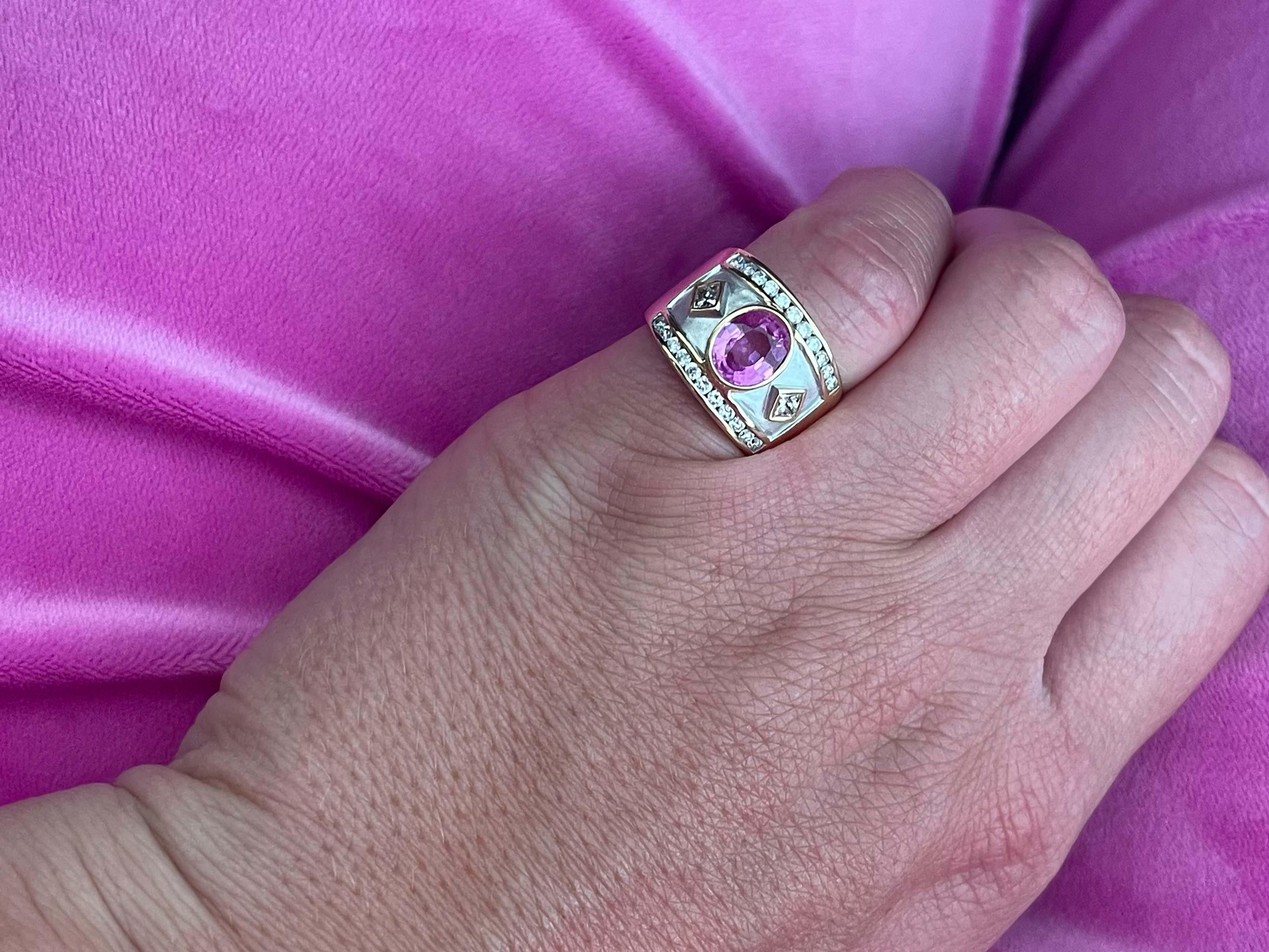 This gorgeous ring features an oval bezel set pink tourmaline 1.28 carats. Beside the tourmaline are 2 princess cut diamonds one on each side totaling 0.20 carats. The top and bottom of the ring have a row of diamonds totaling 0.22 carats. All the