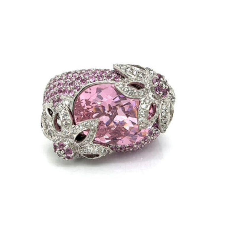 Pink Tourmaline and Diamond Estate Ring

This estate ring offers the perfect blend of beauty and style. Crafted with a multi-faceted oval center stone of pink tourmaline and sparkling diamonds, the ring will captivate onlookers. The size 10 ring
