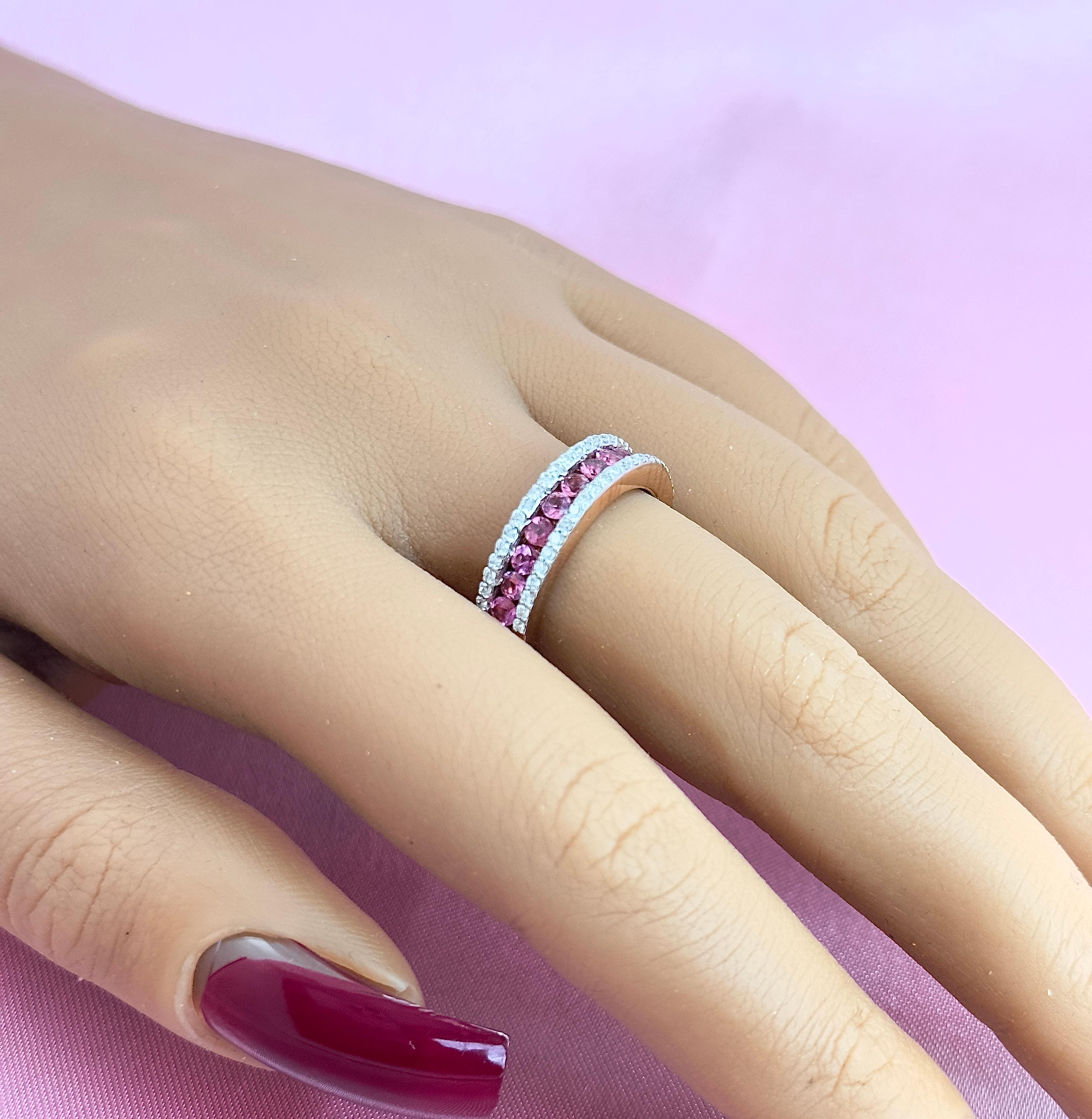 Pink Tourmaline and diamond half band set in rose gold is here! Pink tourmalines are just as beautiful as pink sapphires and they are more affordable. This half band is set in 14k gold with round pink tourmalines set in the center of the band in a