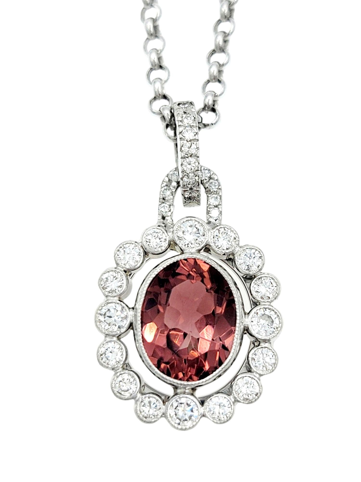 This exquisite pendant necklace features a harmonious blend of tourmaline and diamonds set in white, creating a captivating and elegant piece of jewelry. The oval pink tourmaline takes center stage, radiating a delicate hue and is surrounded by a