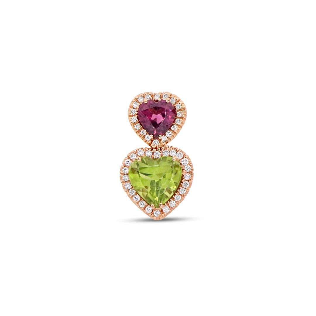 Elevate your style with our exquisite Heart-Shaped Drop Earrings featuring pink tourmaline and green peridot stones, each encircled by a dazzling white diamond halo. These handcrafted earrings, meticulously created in Italy, are the epitome of