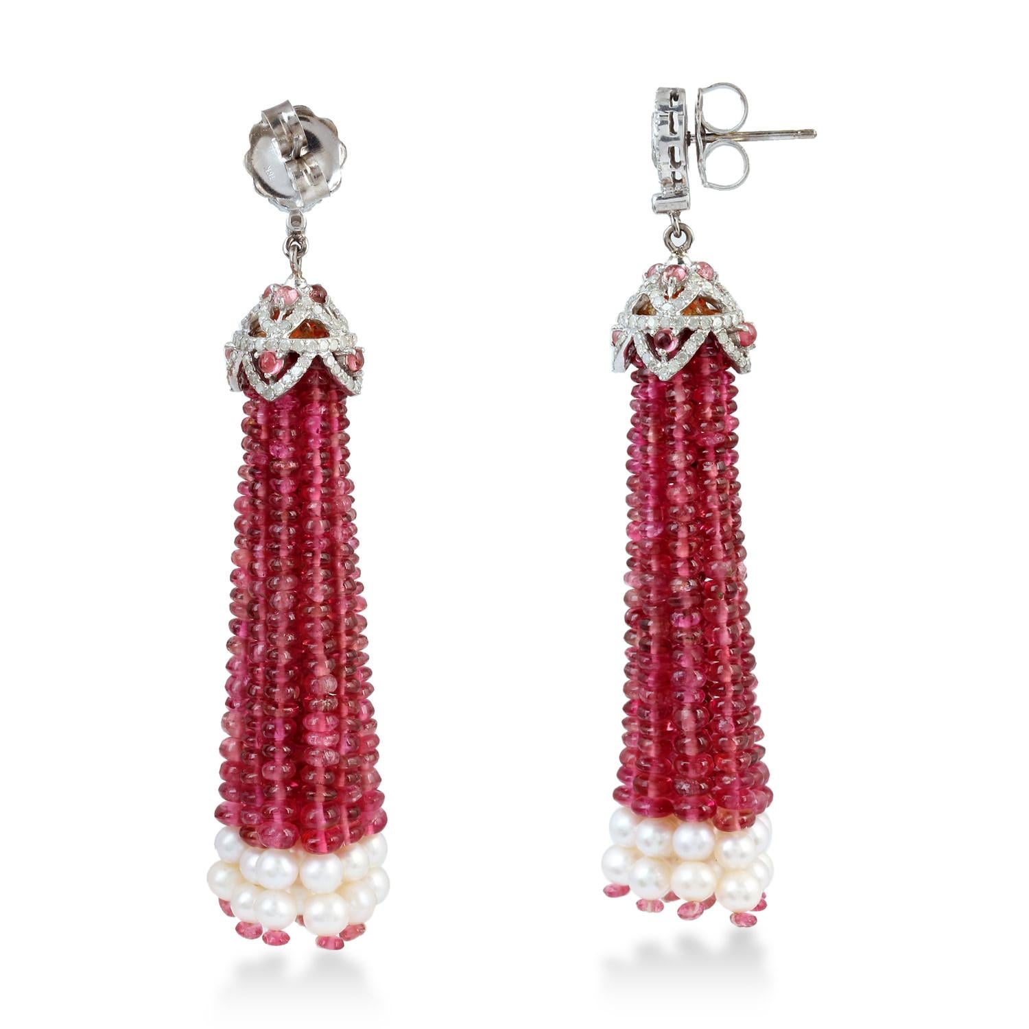 Sassy Pink Tourmaline and Pearl Tassel Earring in Gold and silver with Diamond is super fun.

Closure: Push Post

18KT Gold: 1.59gms
Diamond: 1.54cts
SiIver: 4.093gms
Pearl: 13.56cts
Pink Tourmaline: 60.45cts
