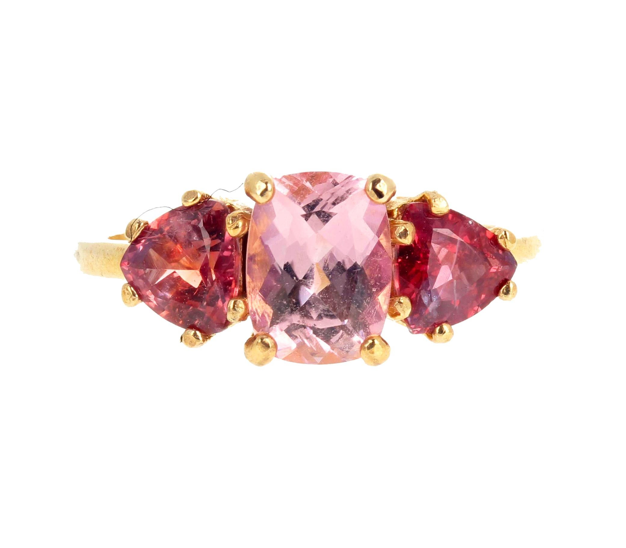 Gorgeous Sri Lankan pink Tourmaline - 1.35 Carats - 8 mm x 6 mm approximately - set with two matching sparkling red natural Spinel trillions set in this lovely 14Kt yellow gold ring size 7 sizable. 