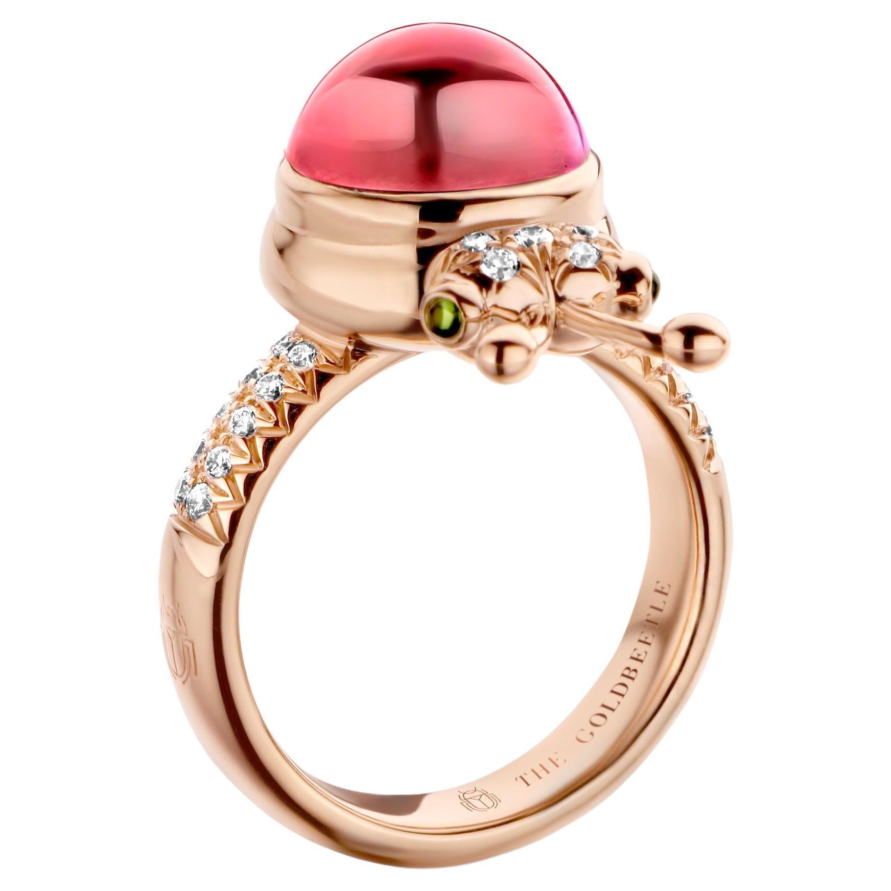 One-of-a-kind lucky beetle ring in 18K rose gold 10g set with the finest natural diamonds in brilliant cut 0,23Ct (VVS/DEF quality) one natural, pink tourmaline in round cabochon cut 6,00Ct and two tsavorites in round cabochon cut. Celine Roelens, a