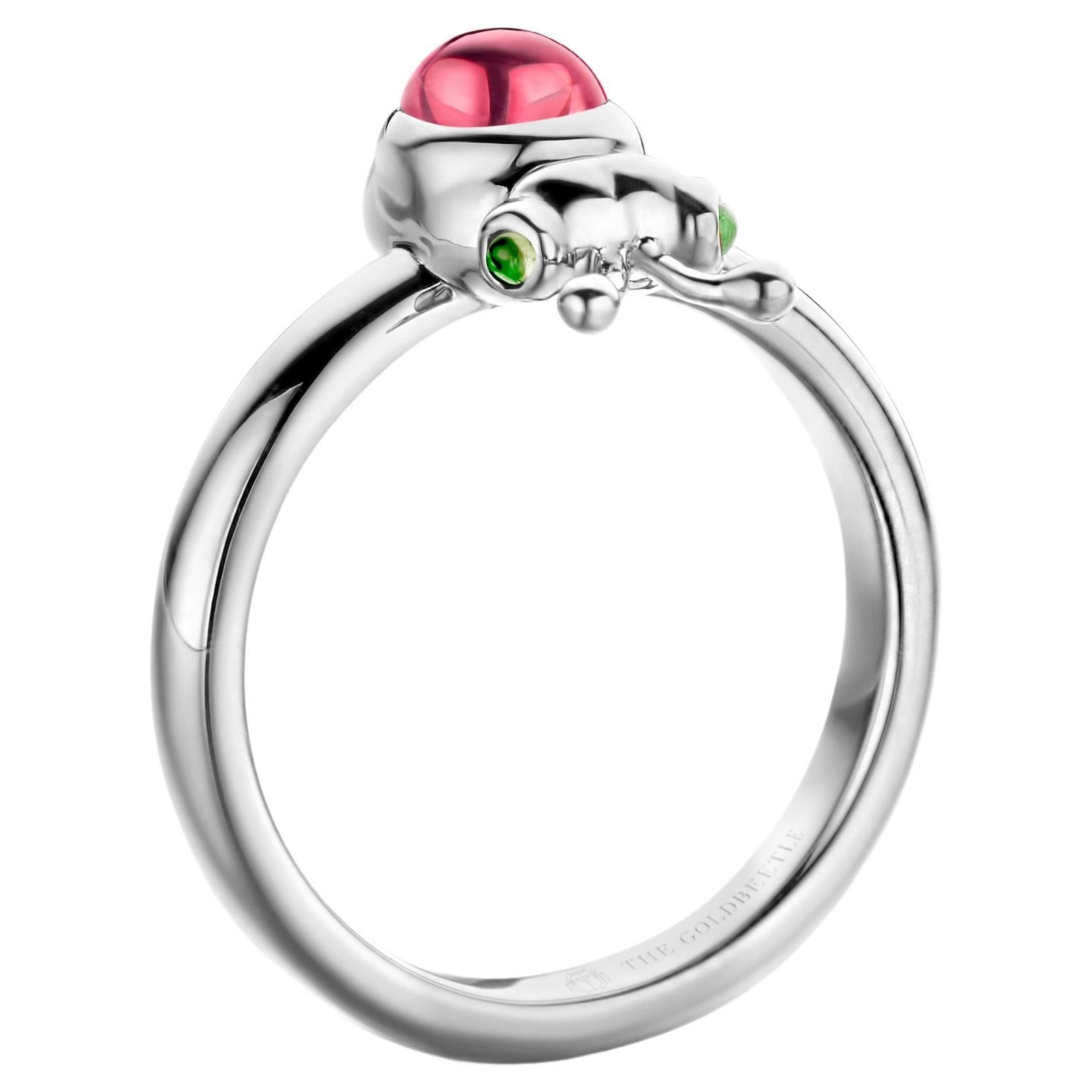 18 Karat white gold Lilou ring set with one natural pear-shaped cabochon Pink Tourmaline and two natural tsavorites in round cabochon cut.
