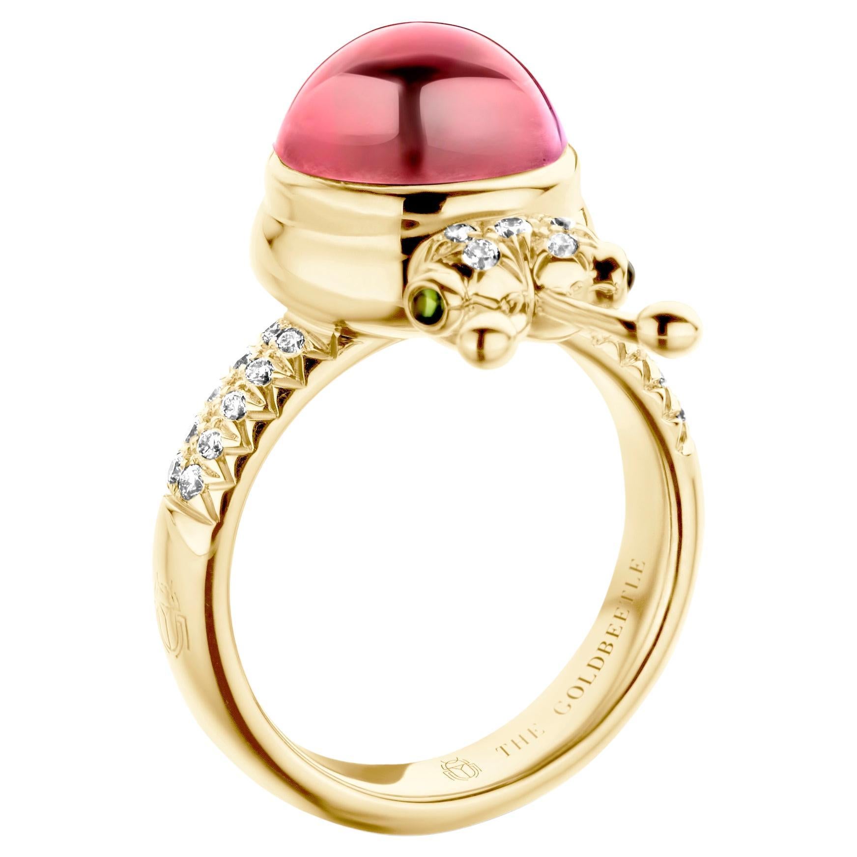 One-of-a-kind lucky beetle ring in 18-Karat yellow gold 10g set with the finest natural diamonds in brilliant cut 0,23 Carat (VVS/DEF quality) one natural, pink tourmaline in round cabochon cut 6,00 Carat and two tsavorites in round cabochon cut.