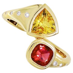 Armreif aus 18 Karat Gelbgold mit rosa Turmalin und gelbem Beryll