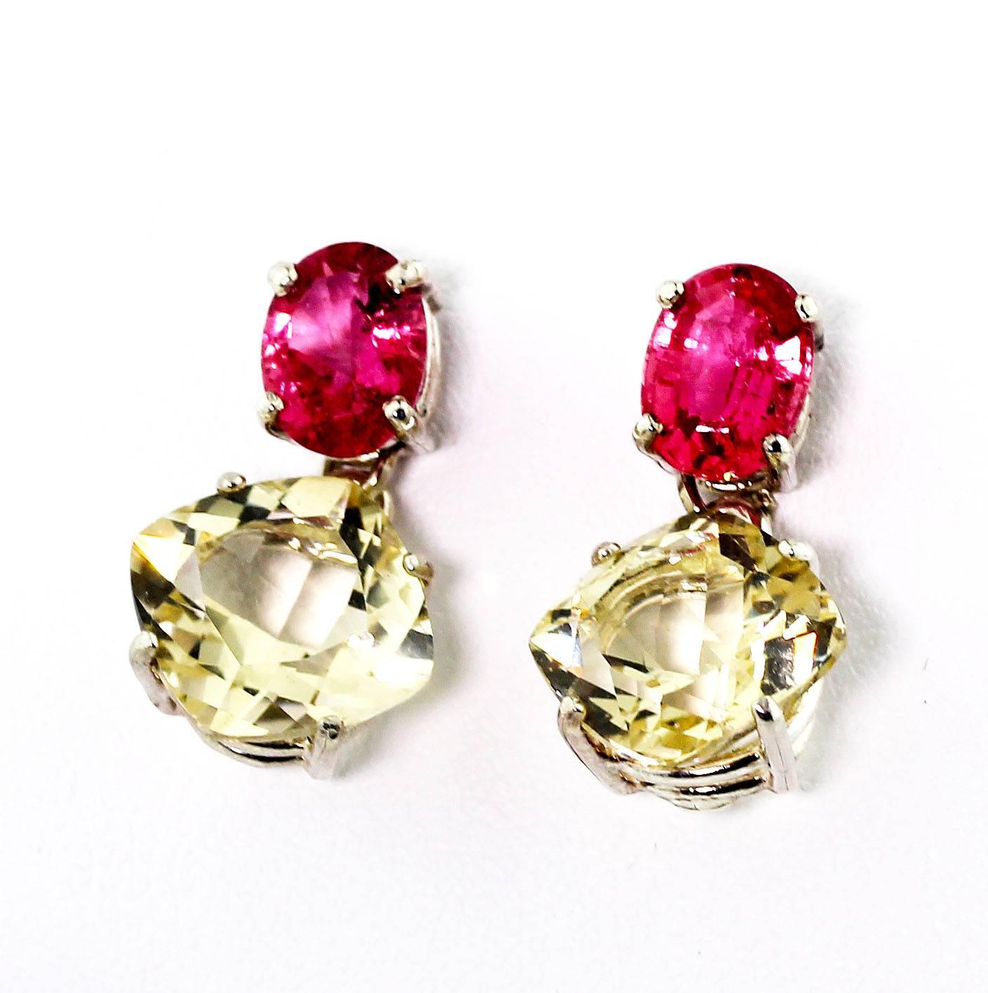 These 2.6 Carats of oval pink Tourmalines (8mm x 6 mm) elegantly dangle 7.94 carats of brilliant sparkling yellow cushion cut Andecine Labradorite (9.7mm x 9.7mm) all set in Sterling Silver stud earrings.  They dangle approximately 7/8 of an inch.