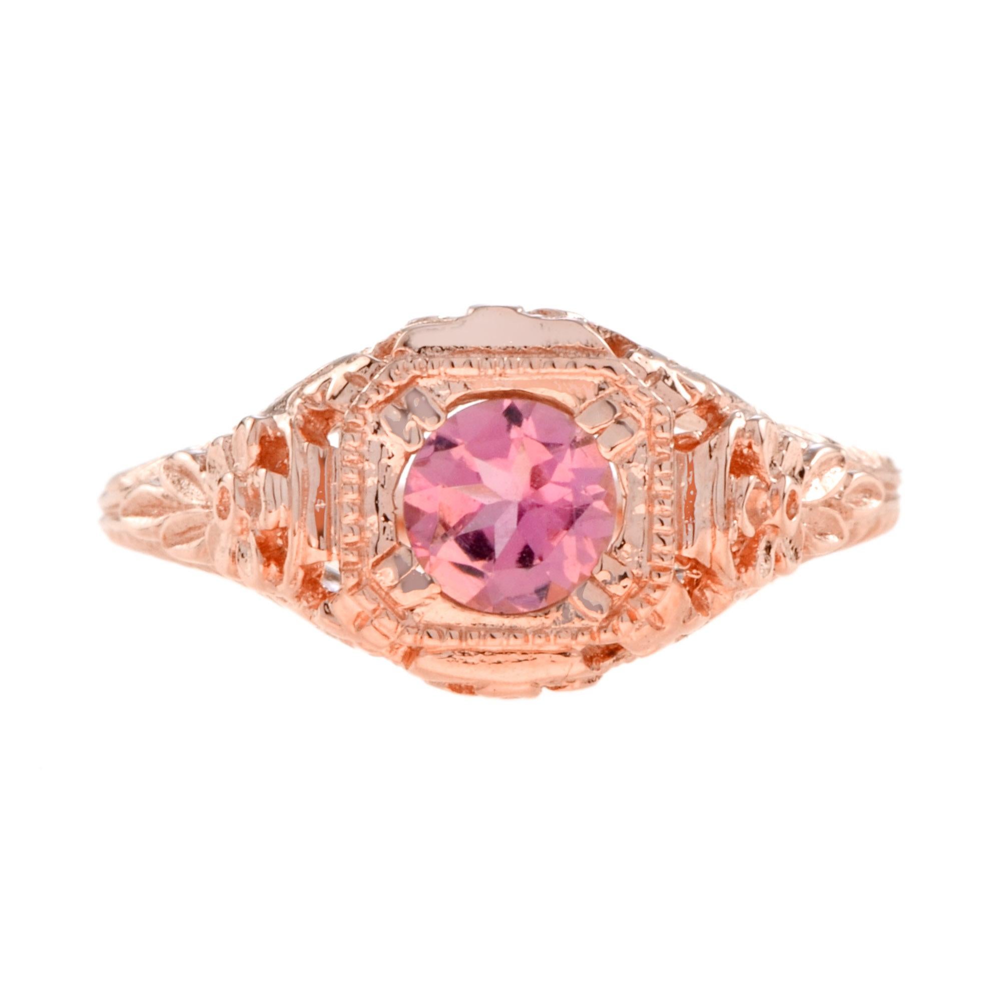 This unique 14K rose gold Art Deco style pink tourmaline filigree engagement ring is crafted in a beautiful antique nature themed engraved filigree design. The natural pink tourmaline of 0.43 carat at the center is set into a secure setting.  

Ring