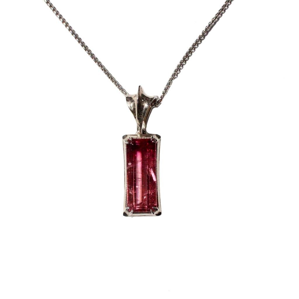 A statement necklace that mixes elegance, edge and sleek design- this solid 14K white gold pendant features the most stunning ombre pink tourmaline baguette. The hand crafted bail hangs on an 20 inch white gold 1.35mm hollow rounded box chain.