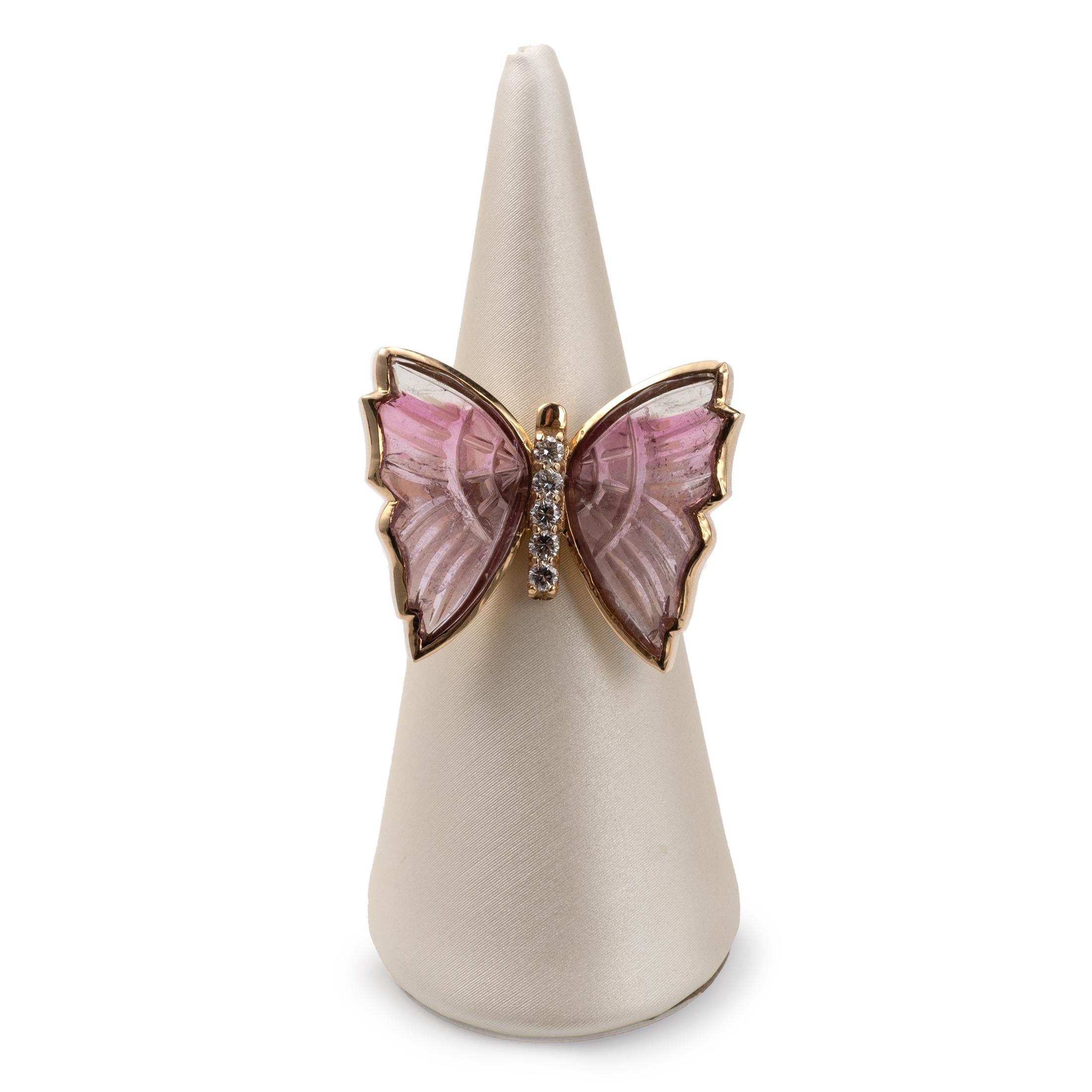 A fantastic statement ring in the form of a Butterfly!

The beautiful butterfly setting is embellished with 5 diamonds set into the body. The wings, made from pink natural tourmaline are carved with some detailing and fit neatly into the gold