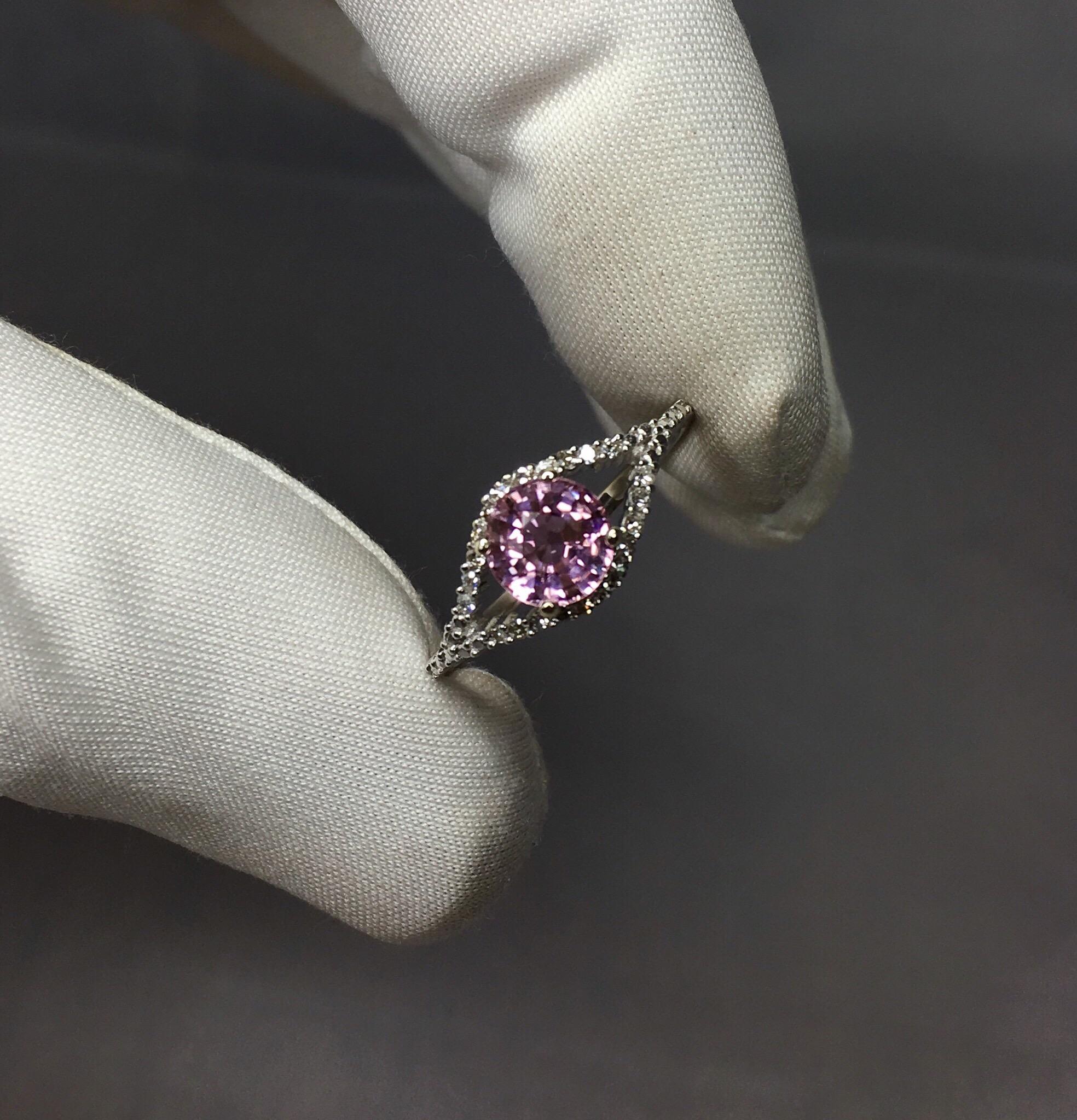 Stunning pink tourmaline set in a fine diamond studded 9k white gold ring setting.

0.90 carat tourmaline with a beautiful colour and excellent clarity. Very clean stone with only small inclusions visible when looking closely. Surrounded by 22