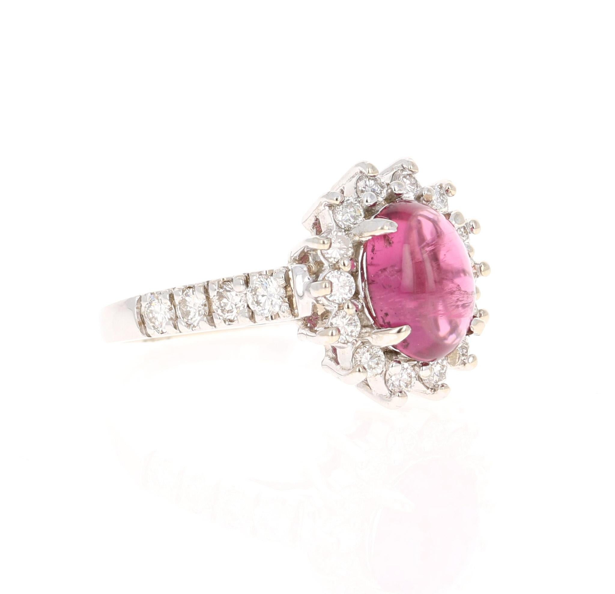 This ring has a Cabochon Oval Cut Pink Tourmaline that weighs 1.75 Carats. There are 22 Round Cut Diamonds that weigh 0.62 Carats. (Clarity: VS2, Color: H).  The total carat weight of the ring is 2.37 Carats. The measurements of the Tourmaline are