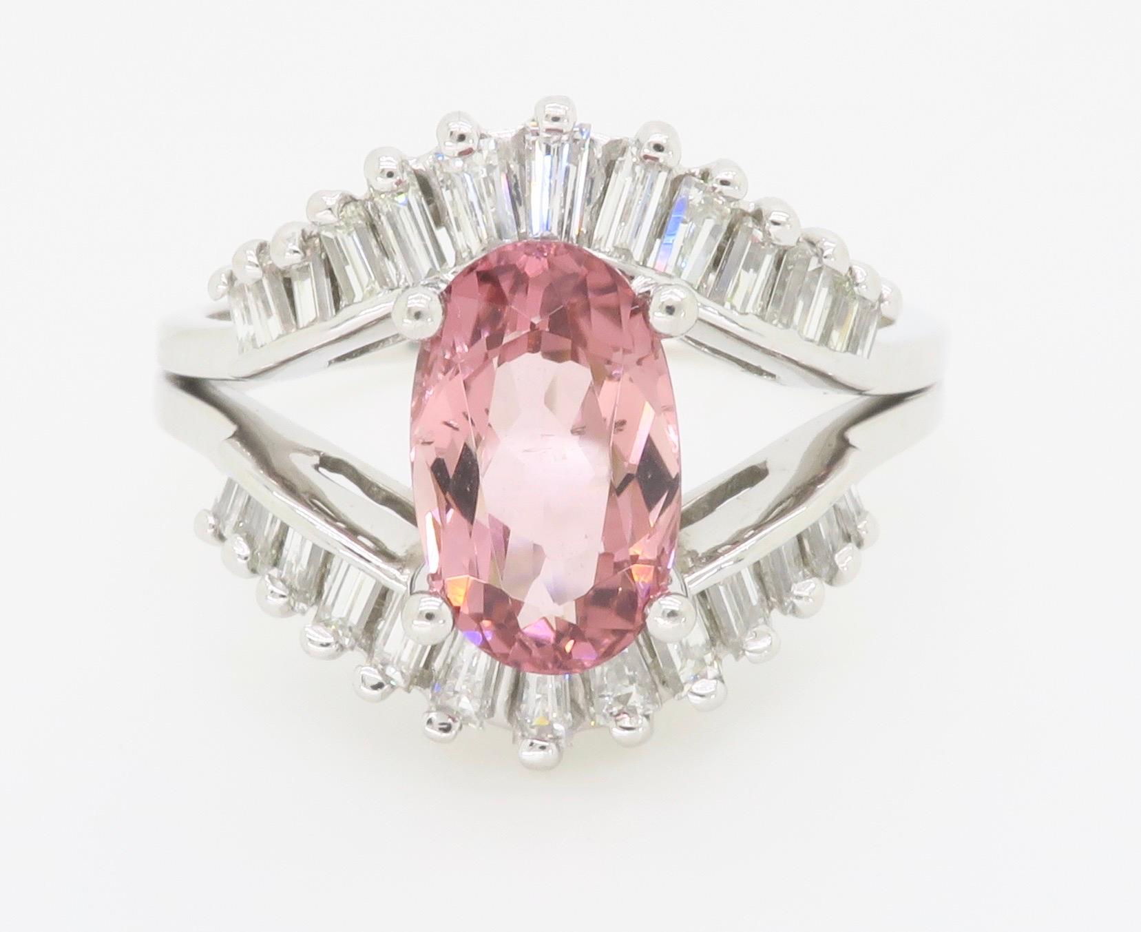 Pink Tourmaline & diamond bypass ring with a 2.03ct Oval Pink Tourmaline set between two rows of Diamonds. 

Gemstone: Pink Tourmaline & Diamond
Diamond Carat Weight: .50CTW
Diamond Cut: Baguette Diamonds
Pink Tourmaline Carat Weight: 2.03CTW
Metal: