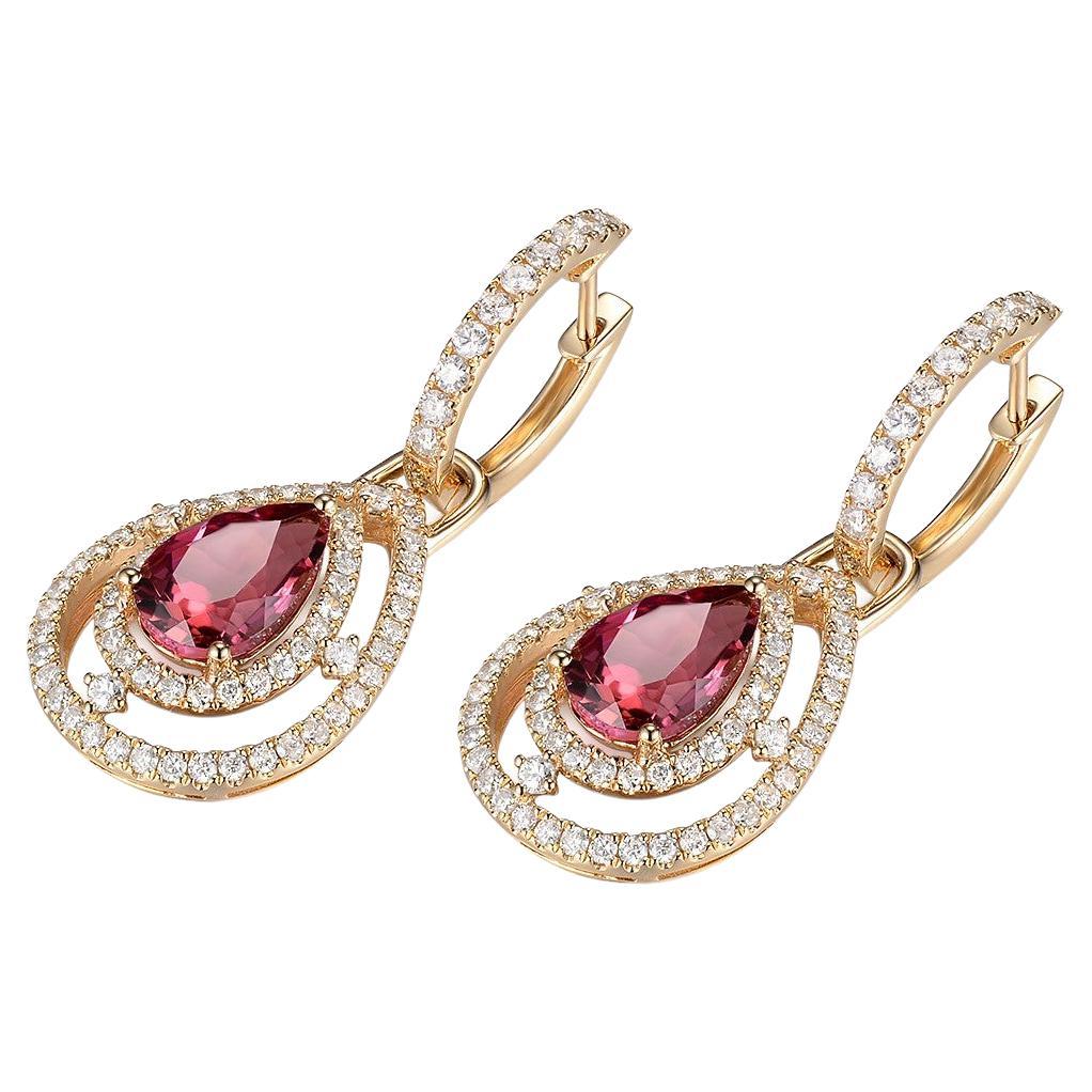 These stunning drop earrings showcase the beauty of pear-shaped pink tourmaline gemstones and the sparkling brilliance of white round diamonds. Crafted in 14 karat yellow gold, these earrings are a true symbol of elegance and sophistication.

The