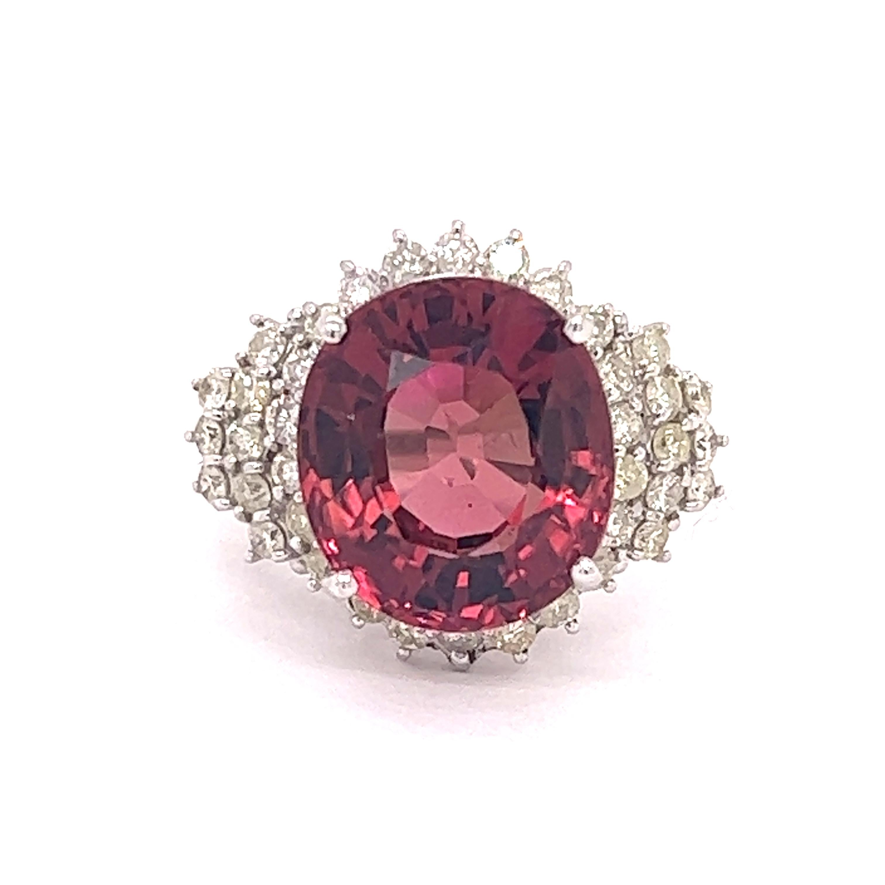 Pinkalicious!  This vintage  pink tourmaline and diamond ring is a stunner!  With approximately six grams of  14K white gold, this is a substantial piece of jewelry.  Approximately 1.0 cttw in round diamonds, I1 Clarity, I-J color.  The beautiful