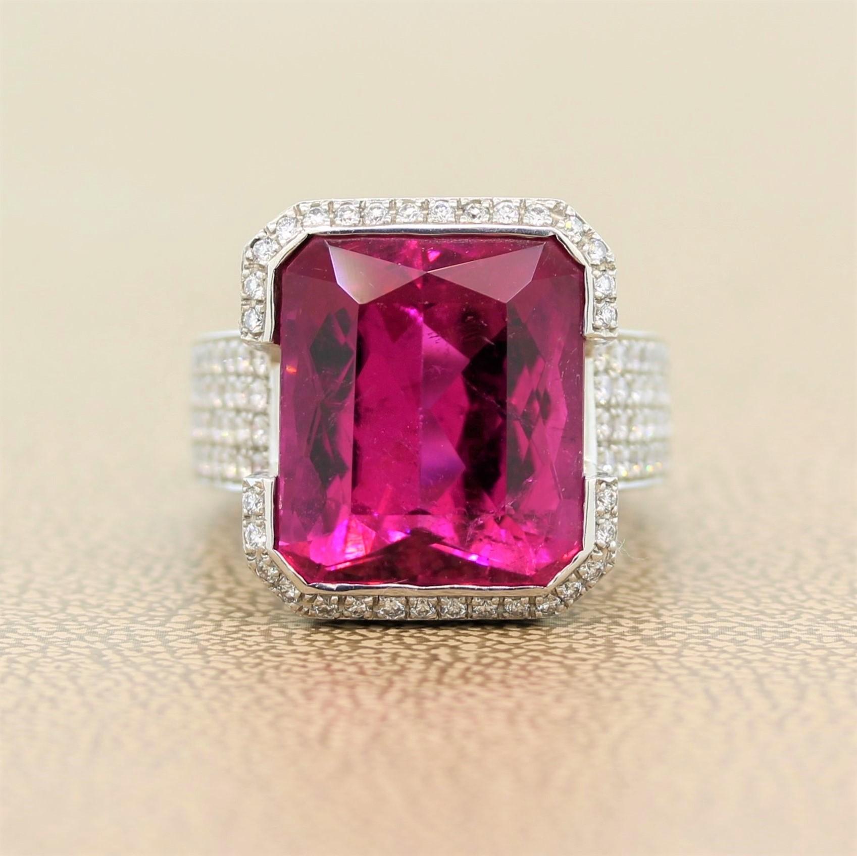 A remarkable ring featuring a 15.54 carat crimson tourmaline. The radiant cut tourmaline is set in a half bezel 18K white gold setting. The ring is accented by 0.70 carats of round cut colorless sparkling diamonds making this cocktail ring easily