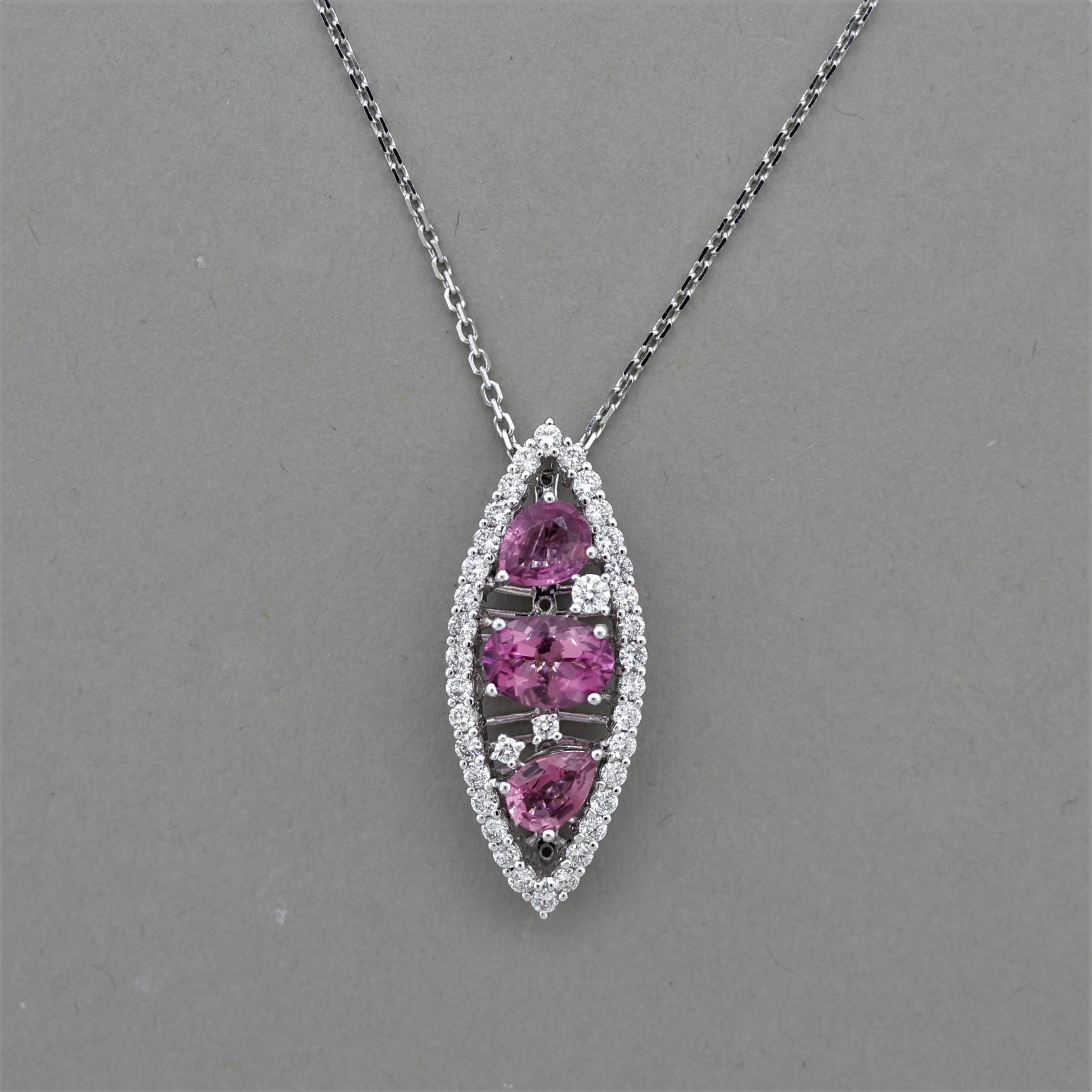 A lovely pendant that will go with any outfit! It features 1.78 carats of pink tourmalines, which include 2 pear shapes and an oval shape in the center. They have a bright pink color that matches each other excellently. Accenting the tourmalines are