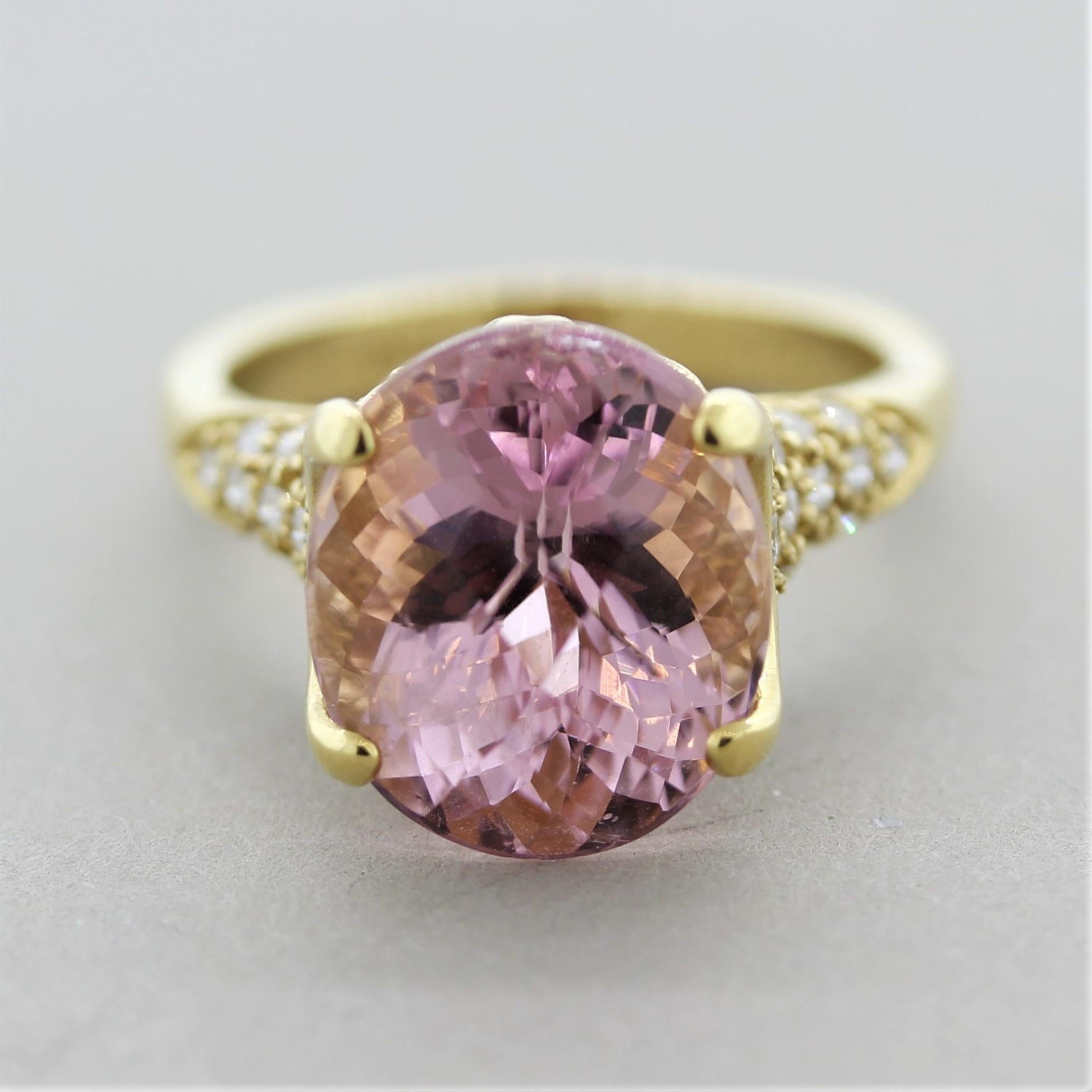 A sleek and sexy ring featuring a 9.90 carat rose cut tourmaline. It has a bright pleasant pink color and is free of any eye-visible inclusions. It is accented by 0.51 carats of round brilliant-cut diamonds set on the shoulders of the ring as well