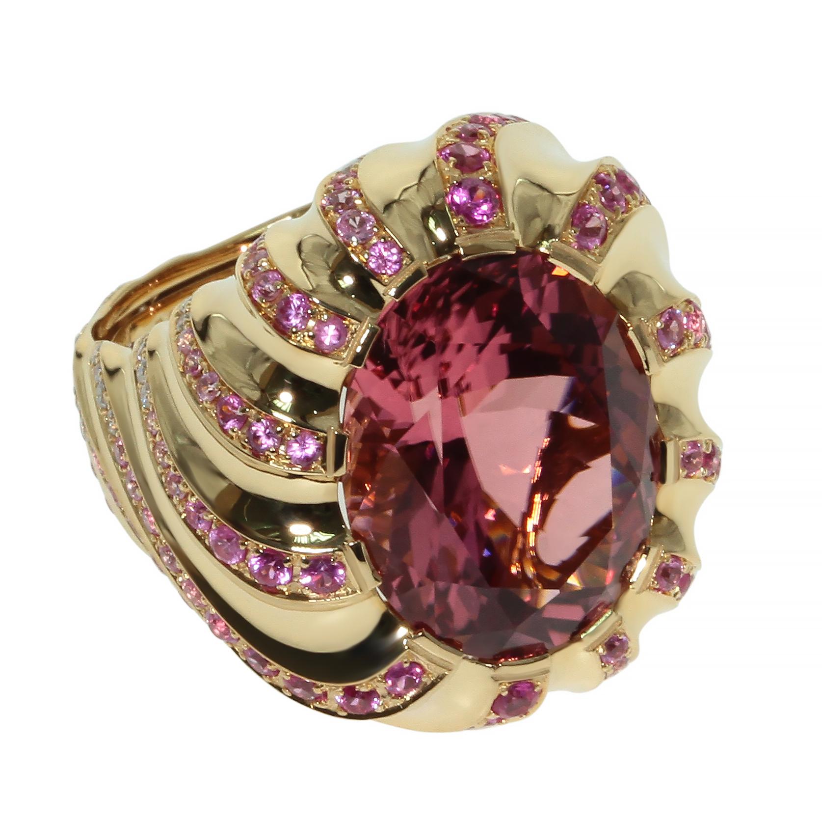 11.96 carat Top Pink Brazilian Tourmaline Diamond Pink Sapphire 18 Karat Yellow Gold Ring

100 percent clean, Hot Pink Color Tourmaline supported be the graduated waves in this ring.
Changes of colors from Pink to white looks just perfect.

Please