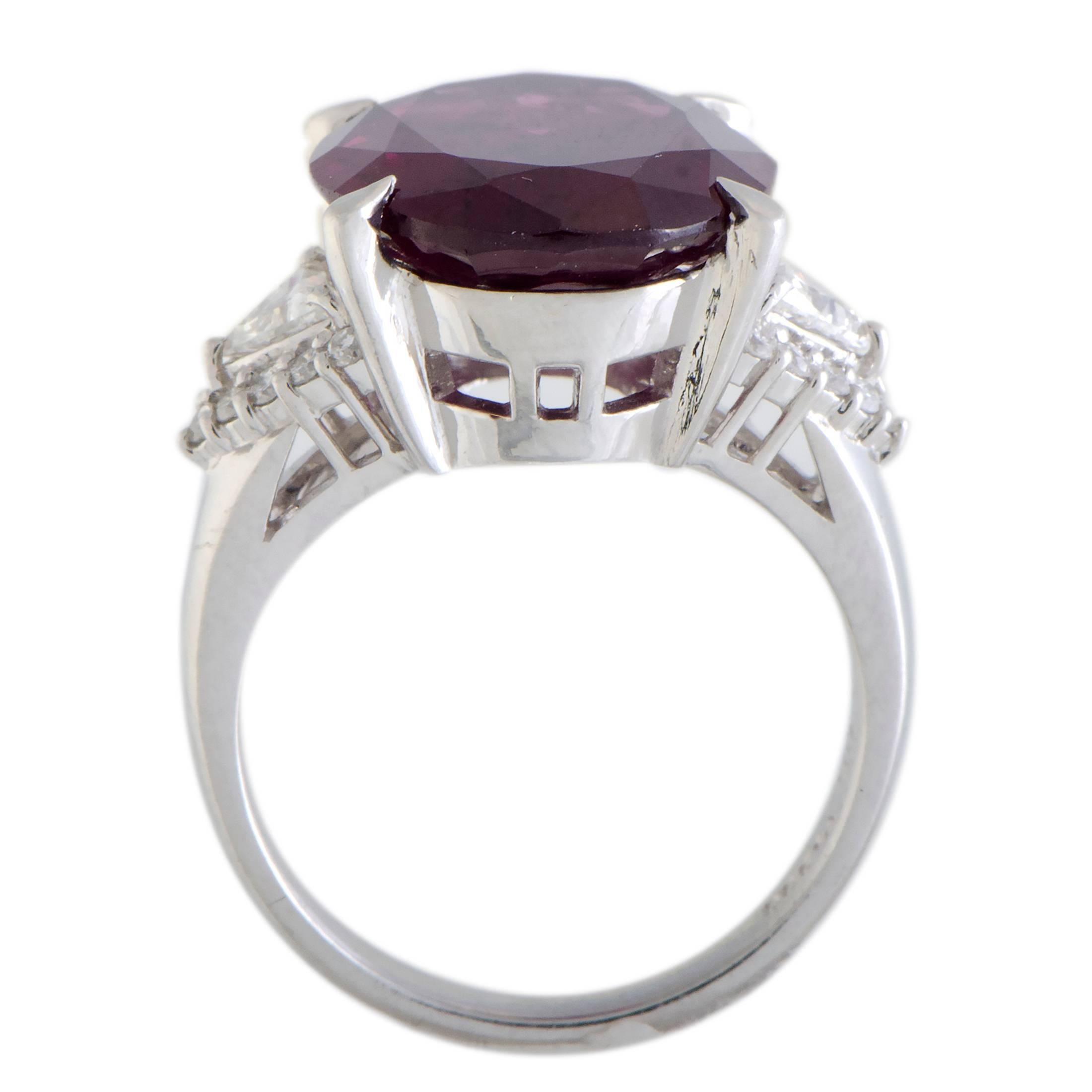 The compelling allure of pink tourmaline is brought to the next level in this superb ring thanks to the bright backdrop comprised of gleaming platinum and glistening diamonds. The tourmaline weighs 10.65 carats, and the diamonds total 0.47