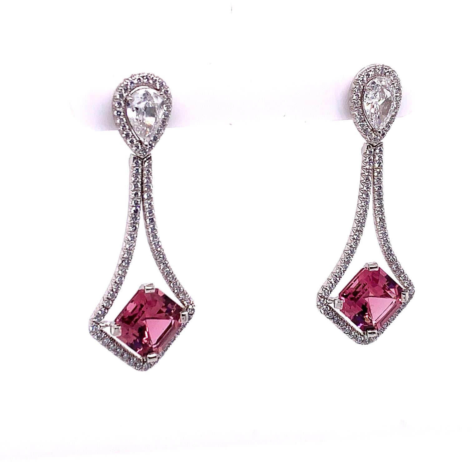 These one of a kind Pink Tourmaline and White Diamond Earrings feature two Asscher cut Tourmalines weighing a total of 6.03 carats, set on a bias: mounted with two Pearshape diamonds weighing .72  and .75 carats, GIA Certified graded D color, VVS2