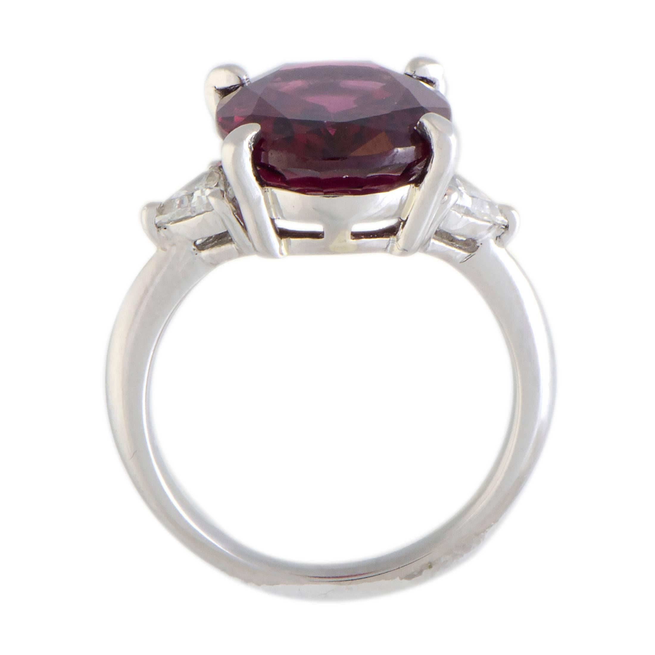 The captivating pink tourmaline is the star of the show in this splendid ring that features elegant design and is made of prestigious platinum. The tourmaline weighs 6.80 carats and it is accentuated by glistening diamonds that amount to 0.28