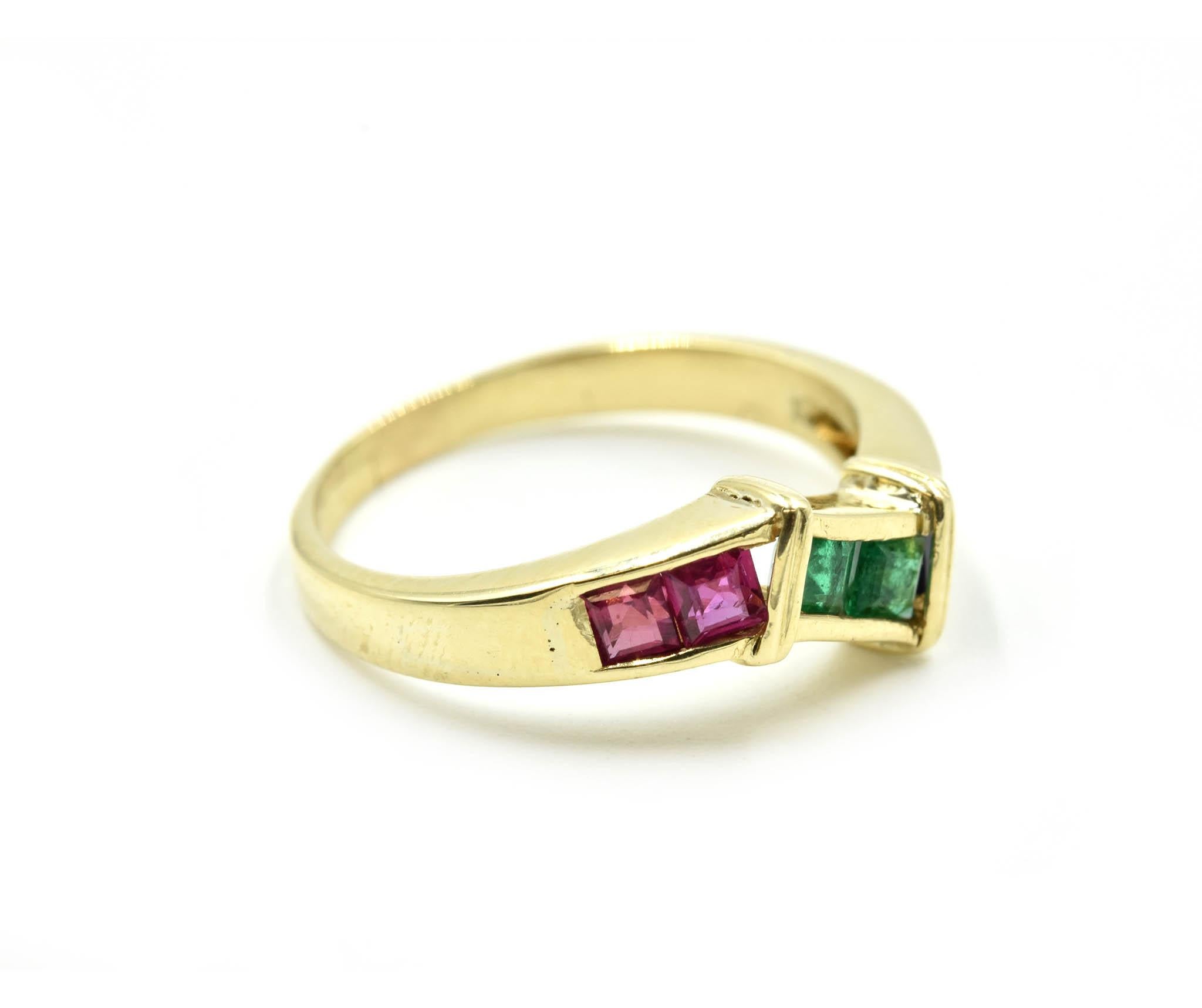 Designer: custom design
Material: 14k yellow gold
Gemstones: pink tourmaline, emeralds and sapphires
Dimensions: ring top is 5.30mm wide
Ring Size: 5 1/4 (please allow two extra shipping days for sizing requests) 
Weight: 2.60 grams
