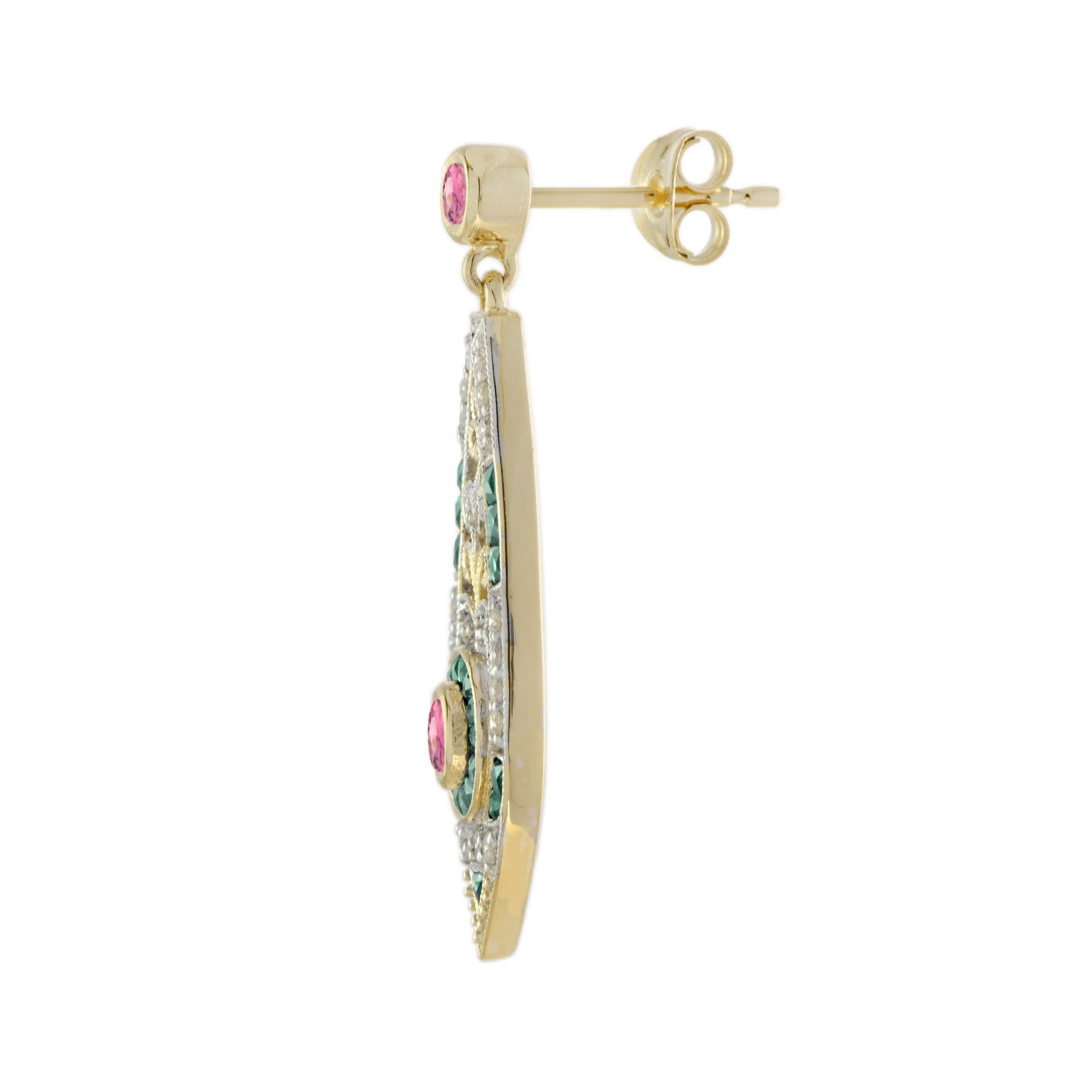 This is an exquisite pair of opal drop earrings with Art Deco ear design. The earrings feature a geometric design which is set with pink tourmaline for their centers, surrounded by French cut emerald and lovely sparkling diamonds. 14K Gold.
