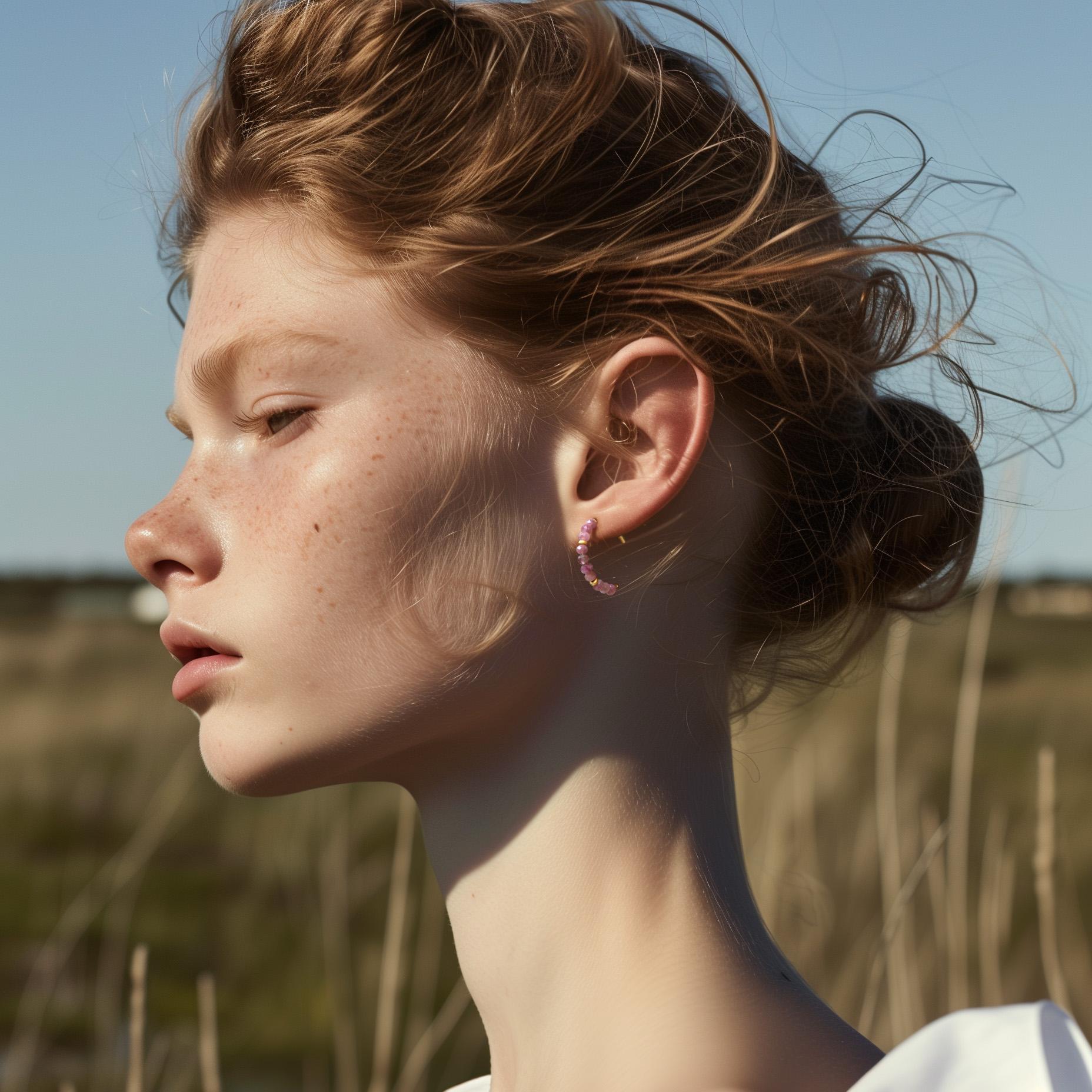 Cascading jewels in shades of dusty rose and deep berry create a symphony of color that frames your face with natural elegance. Each faceted tourmaline catches light differently, creating subtle sparkles that dance with your every movement and