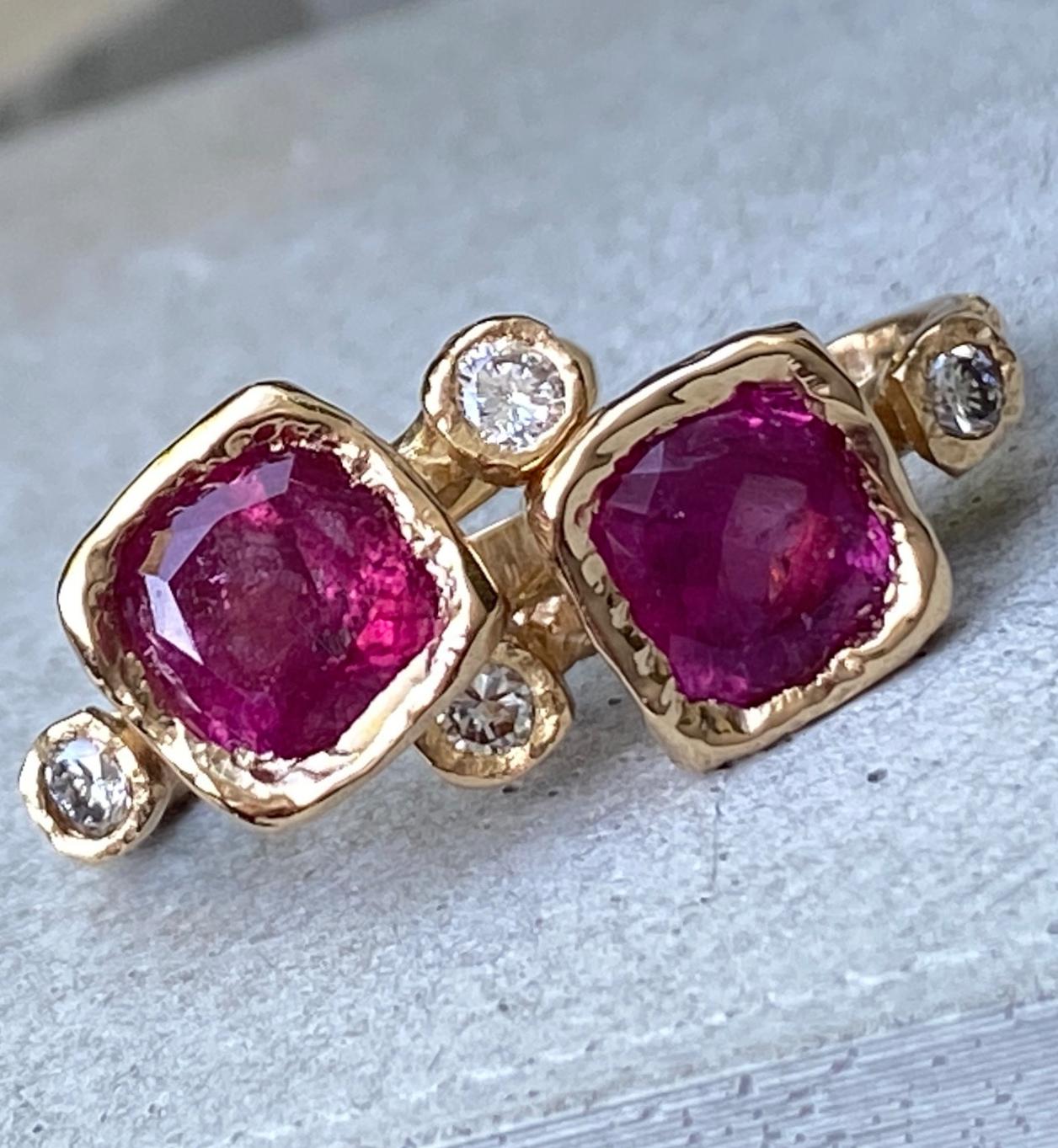 These great little earrings were a bit of an experiment.  Eytan wanted the unmistakable rich pink of natural, untreated tourmaline, but he wanted to encase them in a lot of rough, textured gold, so he decided to get roughly cut and very included