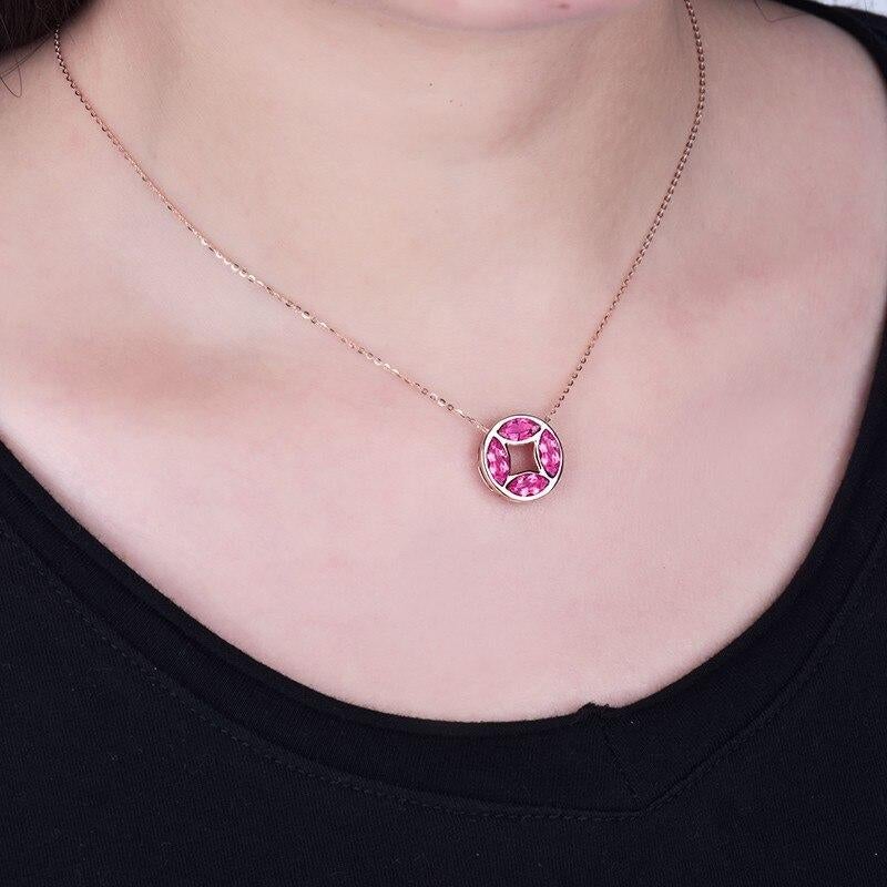 This   1.86 Carat Pink Tourmaline stands out with Marquise shape stones set in a round  Pendant 

 Its  a beryllium aluminium silicate mineral that crystallizes in the form of masses, as well as vertical hexagonal pillars. Most specimens are found