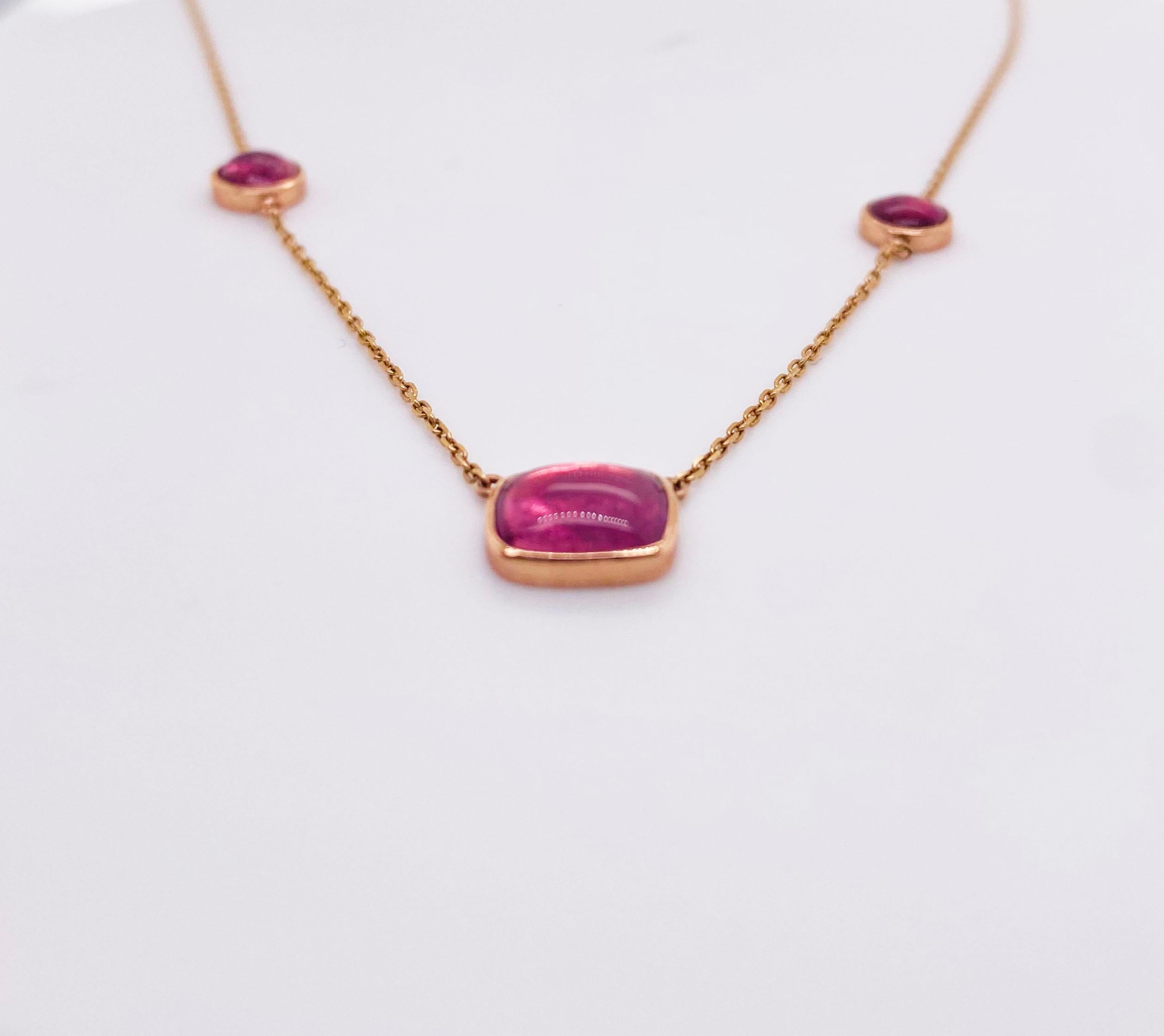 This necklace was carefully hand fabricated in our shop. We selected the 3 cabochon pink tourmaline from a lot of 50 or more. We choose these because all three are the same color and are well cut. The two round gemstones are matching and the