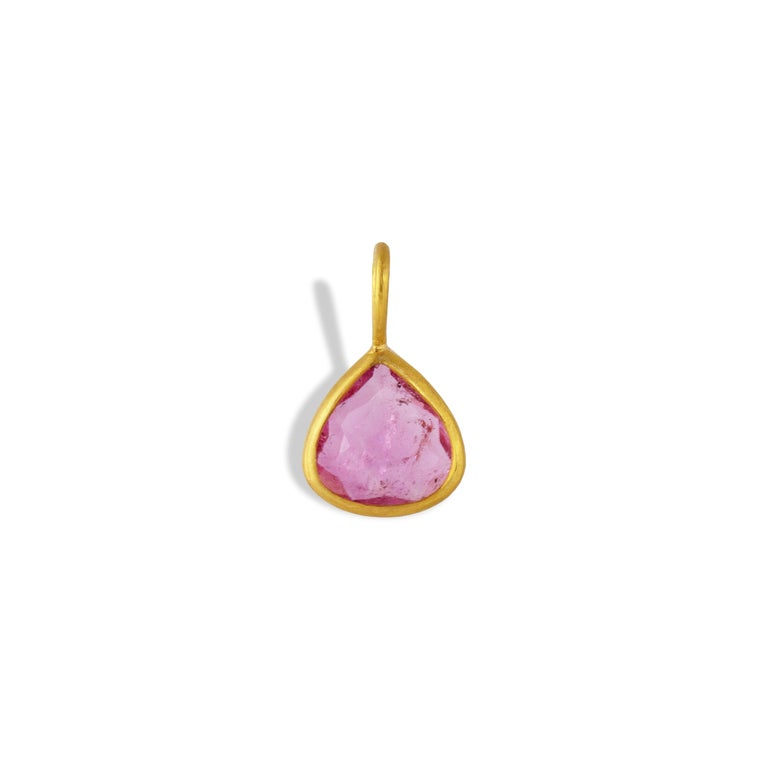 This amazing piece features a Pink Tourmaline pear shaped gemstone measuring 16mm x 9mm set in  22k gold. 

Pink tourmaline represents a love of humanity and humanitarianism . Each Pink Tourmaline stone is unique.  Made in collaboration with the