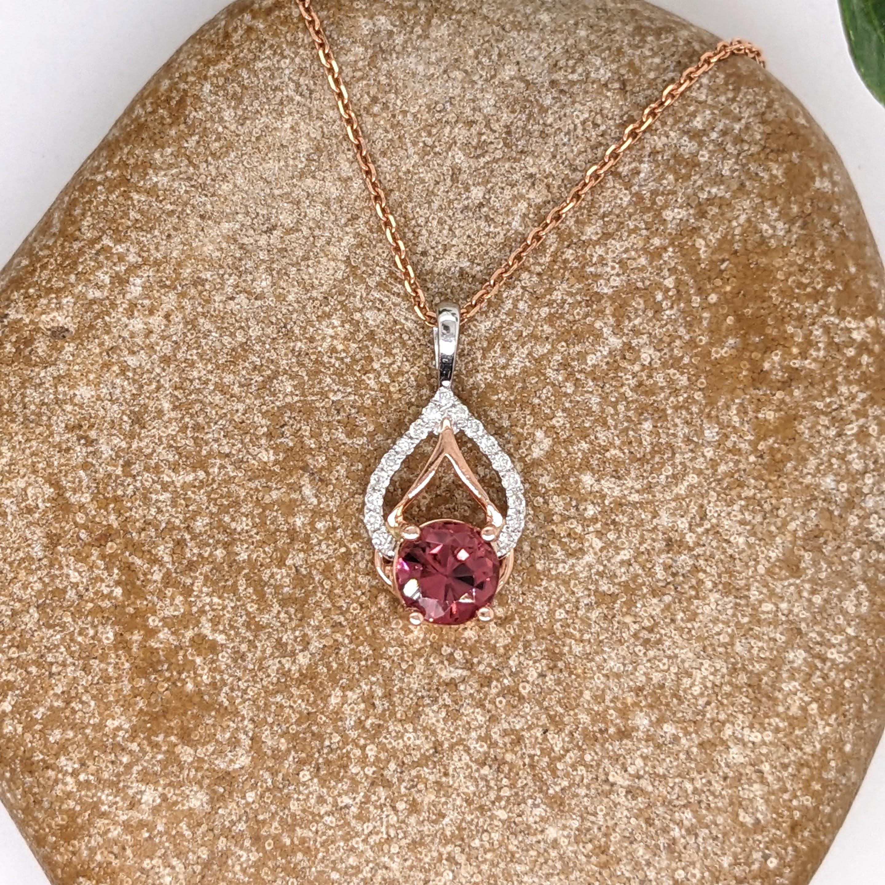 This beautiful pendant features a 0.79ct round pink tourmaline with natural earth-mined diamonds in solid 14k dual tone gold. A fresh and unique design to add to your collection and for everyday wear! 

Specifications

Item Type: Pendant
Center