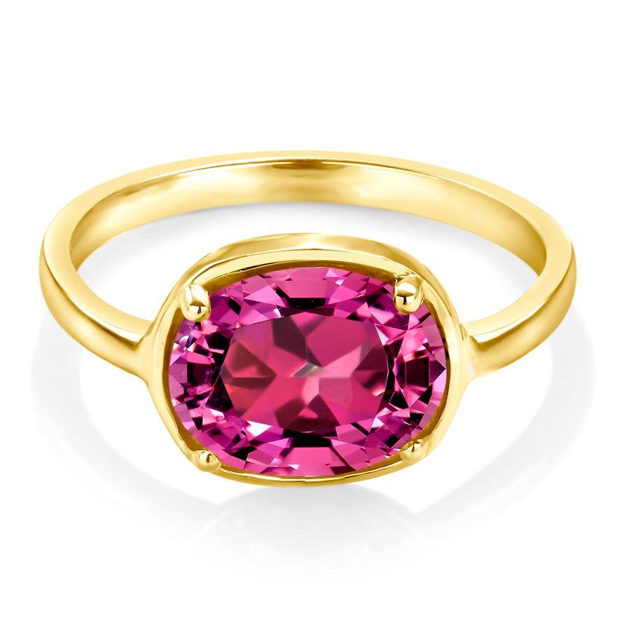 Fourteen karats yellow gold raised bezel dome cocktail ring
Pink Tourmaline weighing 1.80 carats
The pink hue is of a magenta pink tone                                                        
Ring size 5 In Stock
The ring cannot be resized 
New