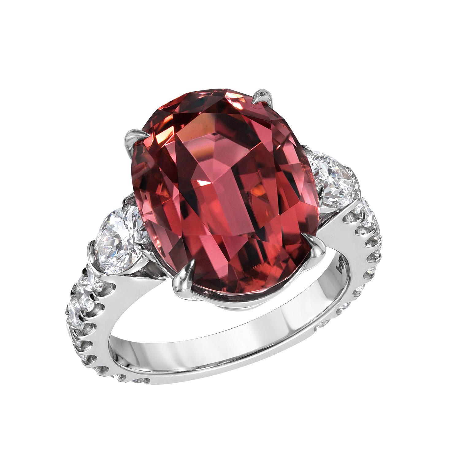 Marvelous 9.55 carat Pink Tourmaline oval platinum ring, decorated with a pair of 0.67 carats, E color/VS2 clarity, oval diamonds, and a total of 0.77 carats, round brilliant collection diamonds.
Size 6. Re-sizing is complimentary upon