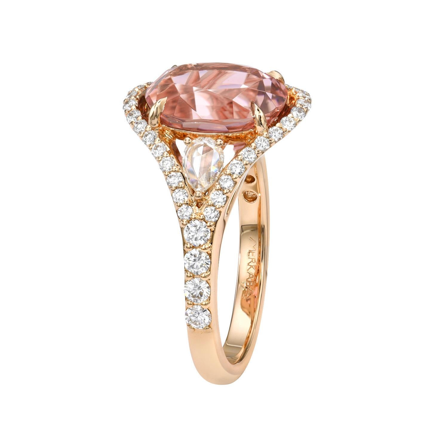 Desirable 4.47 carat Pink Tourmaline oval, 18K rose gold ring, decorated with a pair of 0.21 carat Rose Cut pear shape collection diamonds, and a total of 0.61 carat collection round brilliant diamonds. 
Ring size 6.5. Resizing is complementary upon