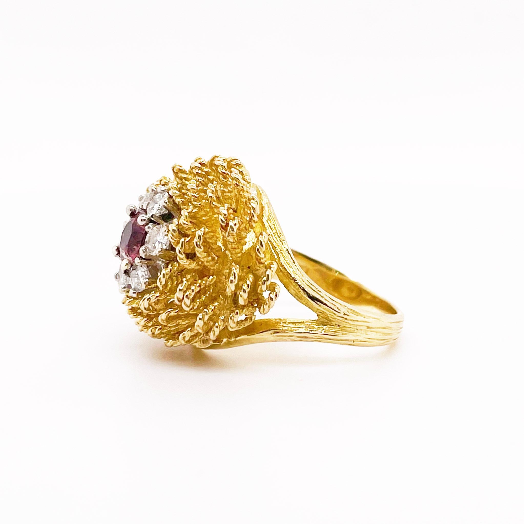 This Lilly ring is our favorite design of the season! It is domed in shape but has lots of texture and bling! The twisted rope petals makes for a perfect flower with six diamonds surrounding a pinkish tourmaline! This ring is very high quality with