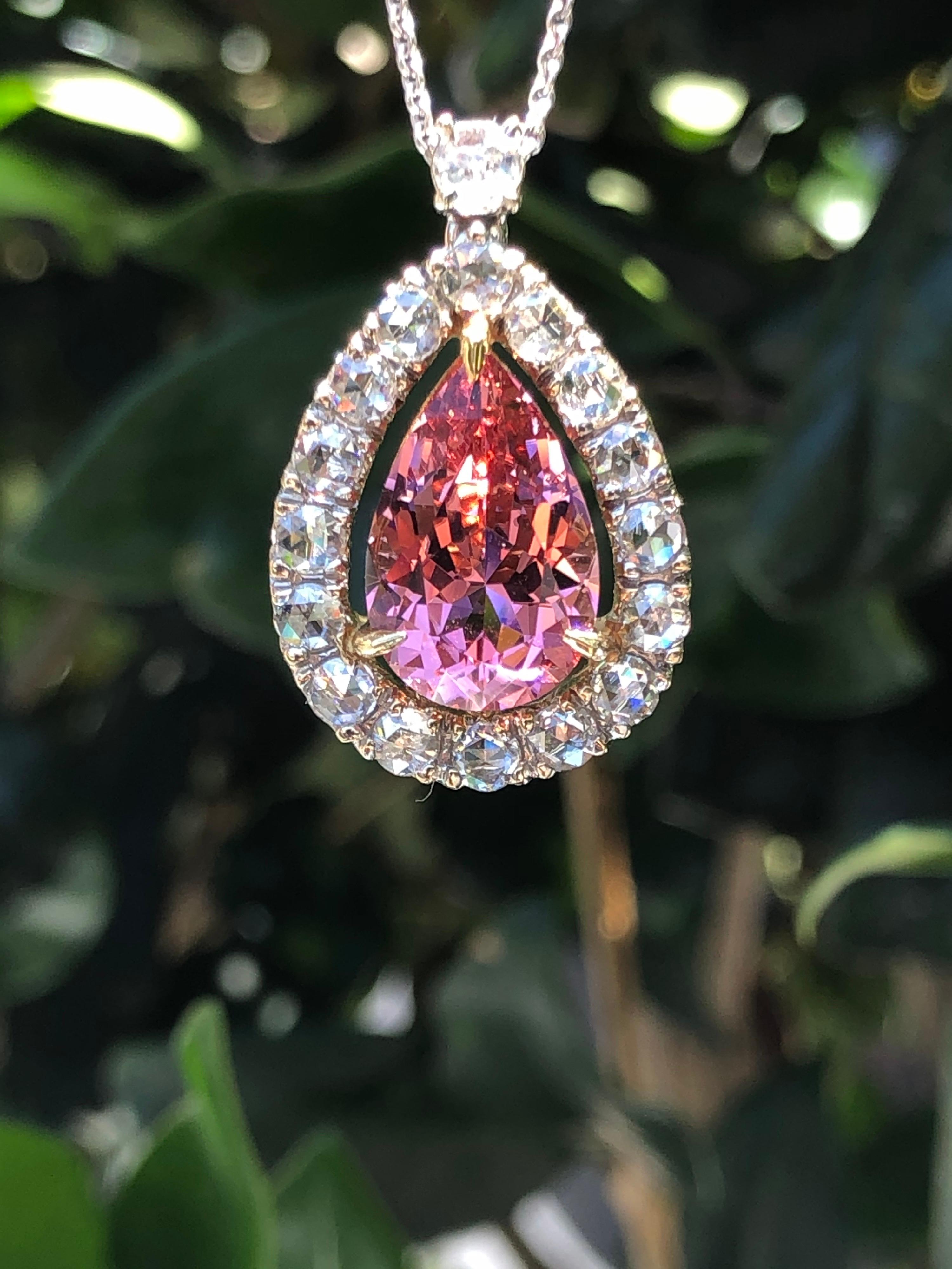 Gorgeous 4.70 carat pear shaped Pink Tourmaline is set in this 18K white and yellow gold pendant necklace , adorned by a total of 1.19 carat rose cut diamonds.
The chain length is 18