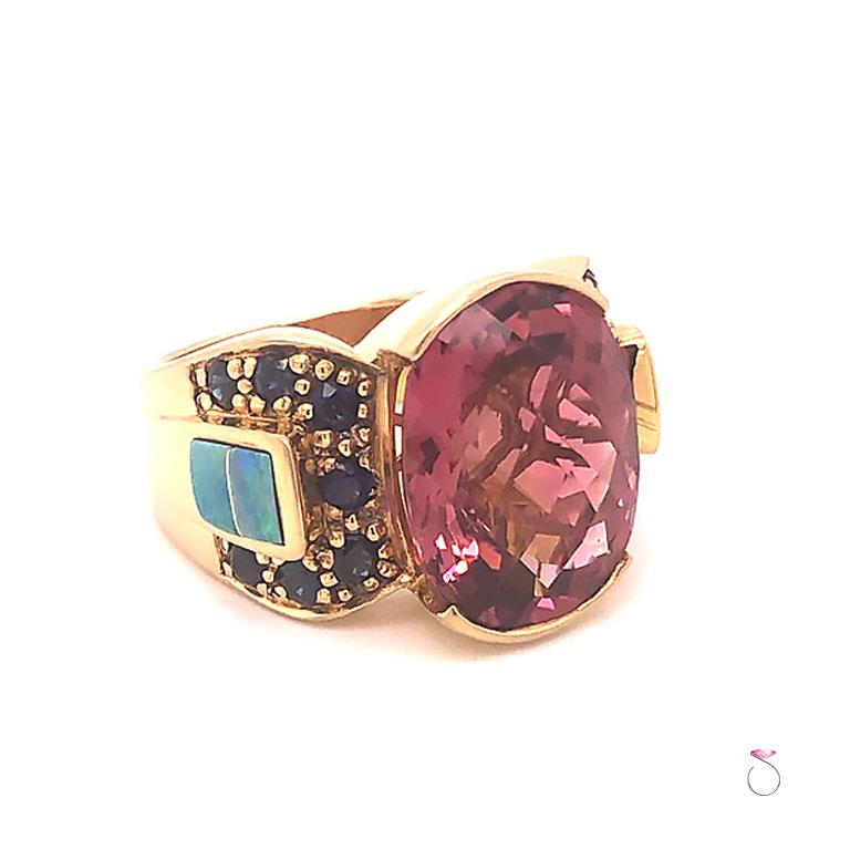 Beautiful large pink tourmaline ring in 18k yellow gold. This ring features an oval checkers brilliant cut rich pink Tourmaline center set in a semi bezel. The pink tourmaline measures 15.20 mm x 11.70 mm x 7.96 mm and weights approximately 8.50