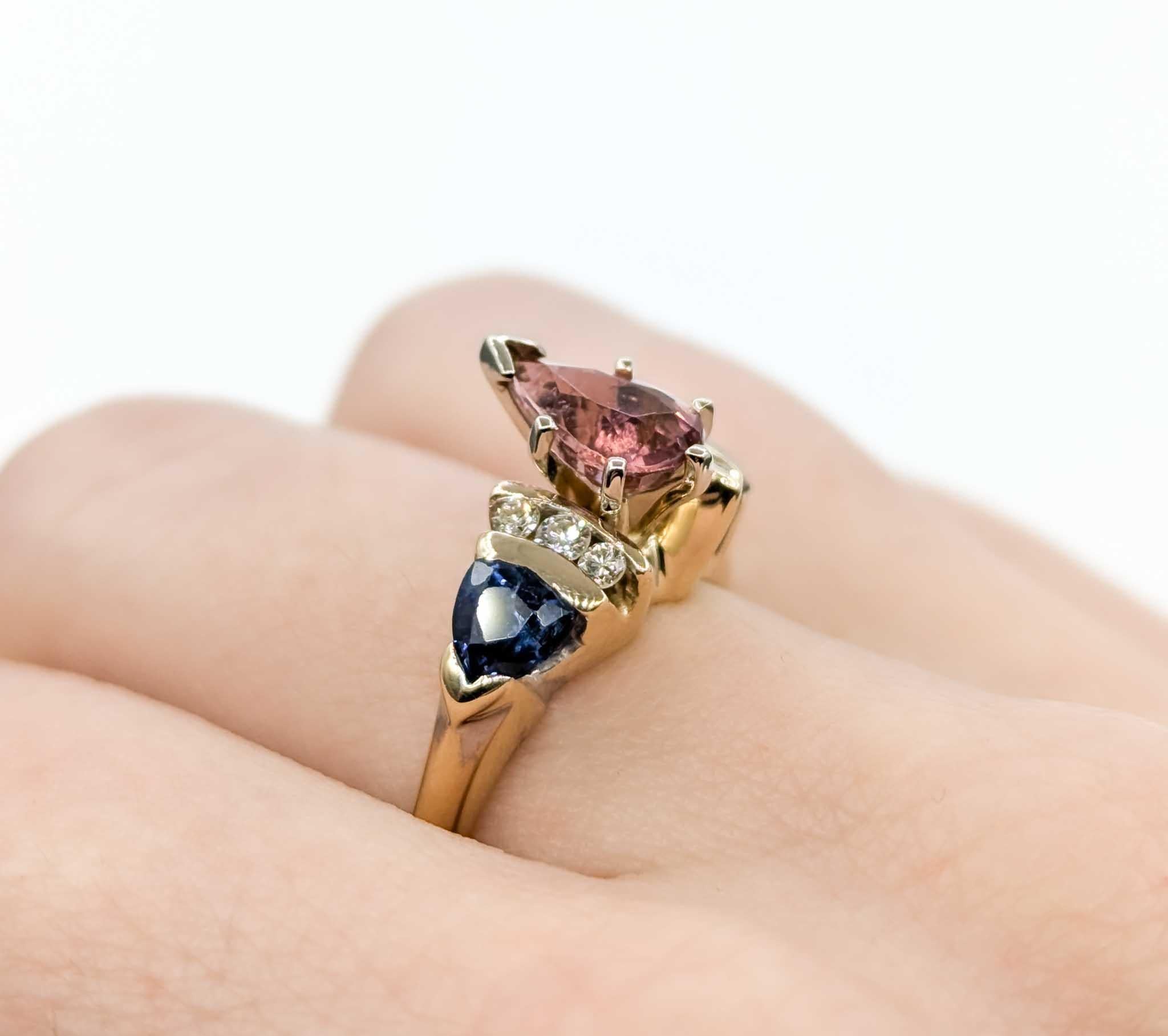 Pink Tourmaline, Sapphire & Diamond Ring in 14k Yellow Gold

This beautiful ring is crafted in 14k two-tone gold and features a 1.07ct pink tourmaline centerpiece, the birthstone for October. Pink tourmaline is believed to promote love, compassion,