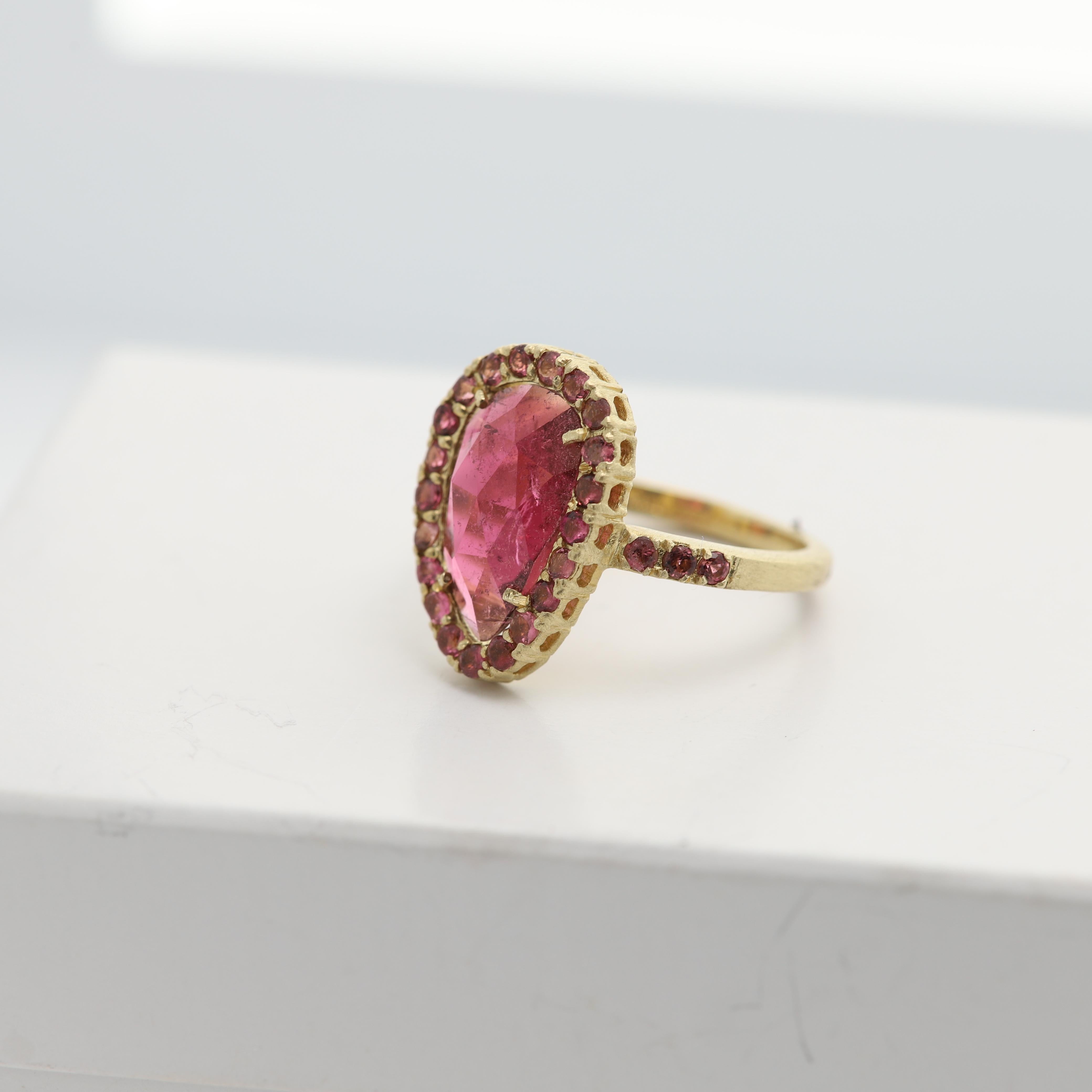 Vintage Pink Tourmaline Ring - Hand Made in Italy
14k Yellow Gold 4.80 grams - mat finish (not shiney gold)
Small Round Pink Tourmaline arround on the sides 0.58 carat 
Center is a 